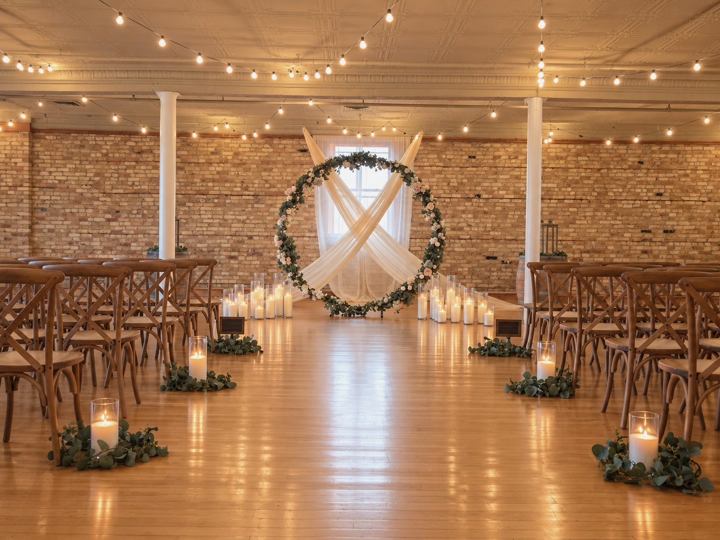 Glass cylinder candlelight lining a ceremony aisle