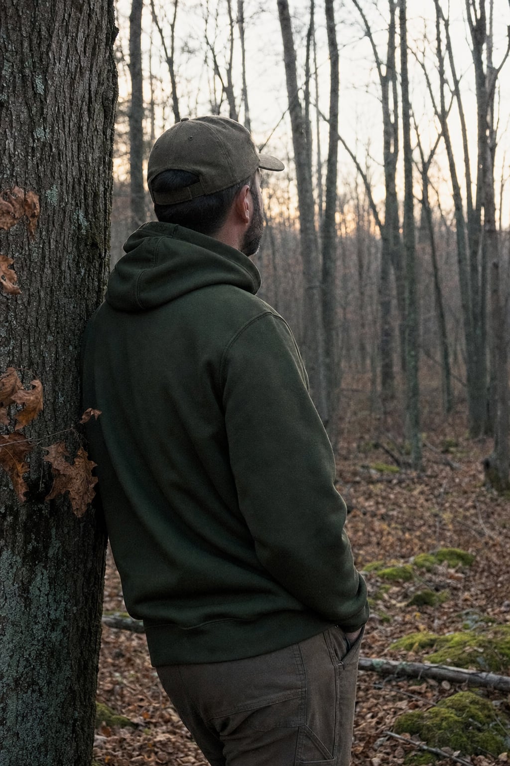 Hunter standing in quiet Michigan timber