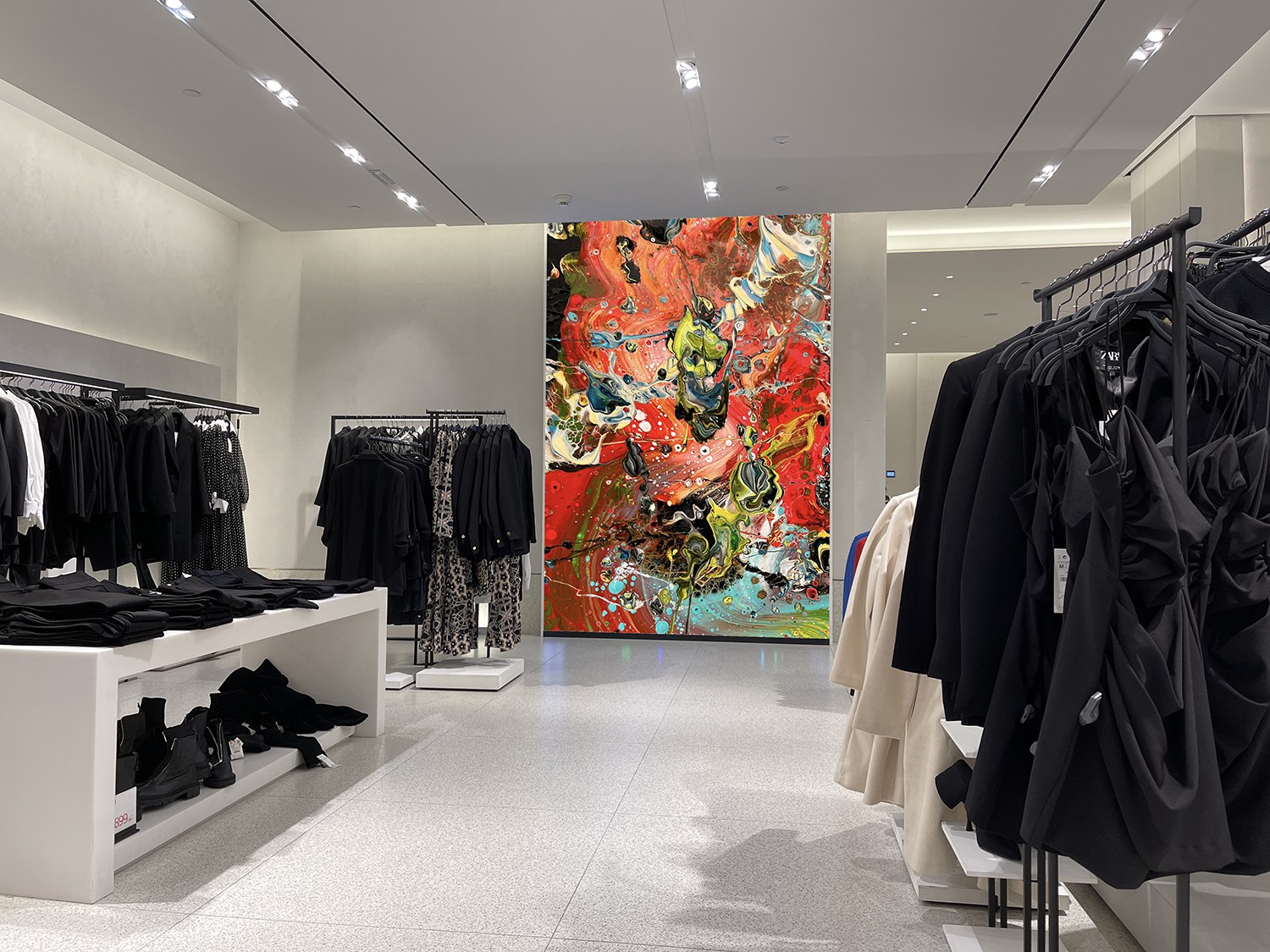 Michel Keck artwork featured as a bold focal point in a fashion boutique