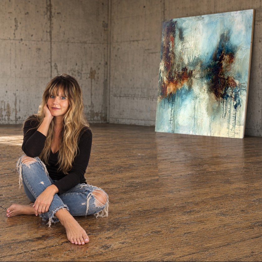 Michel Keck seated in her studio in front of Nothing Comes Easy