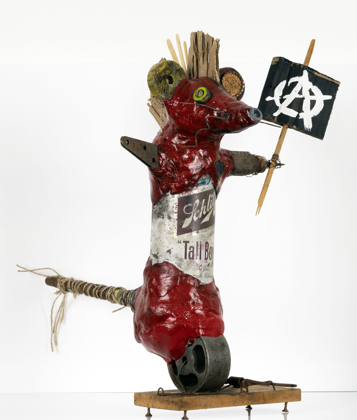 Anarchy Rat, a red found-object animal sculpture holding a flag