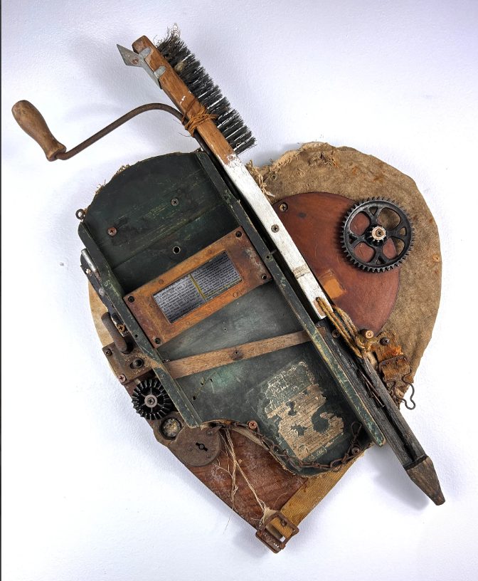 Sold Bow and Arrow Heart found-object wall assemblage
