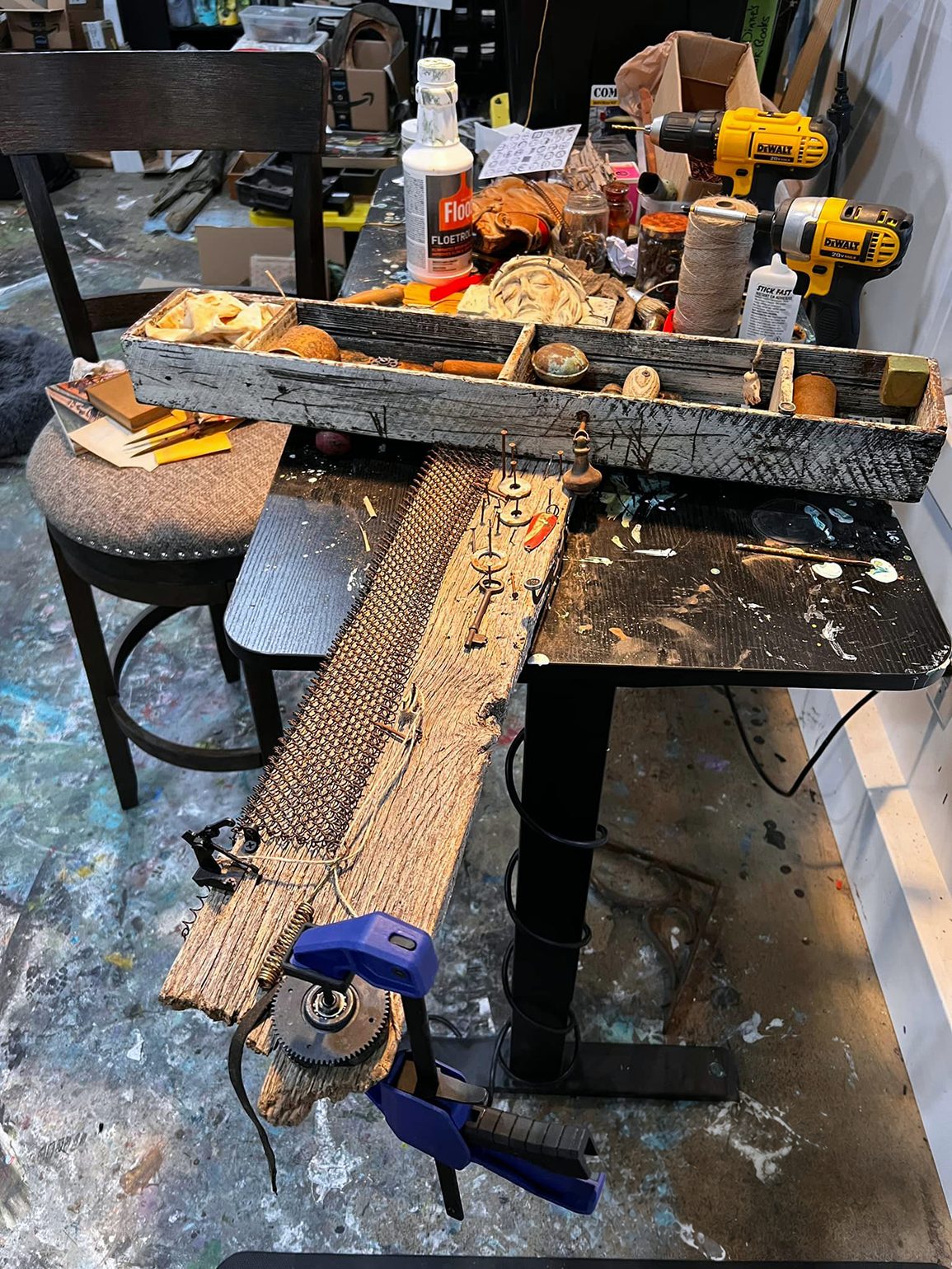 Found-object cross assemblage in progress on Michel Keck’s workbench