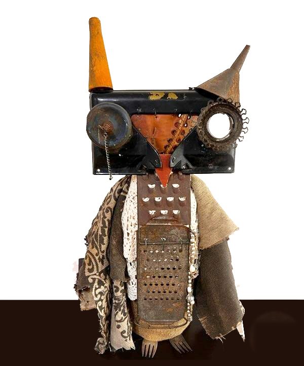 Owl sculpture assembled from found metal, wood and fabric