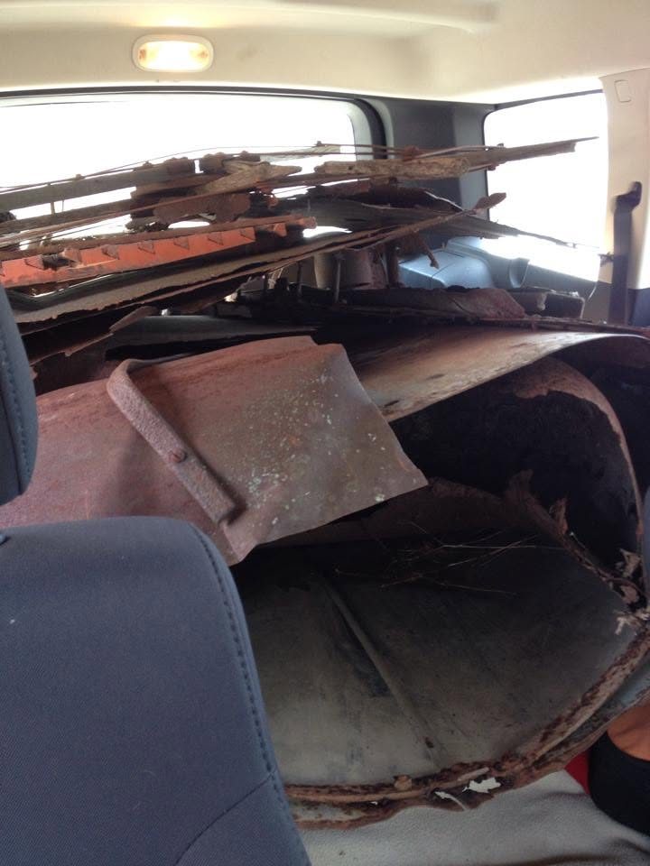 The back of our SUV packed with reclaimed wood, rusty metal and junk collected for art