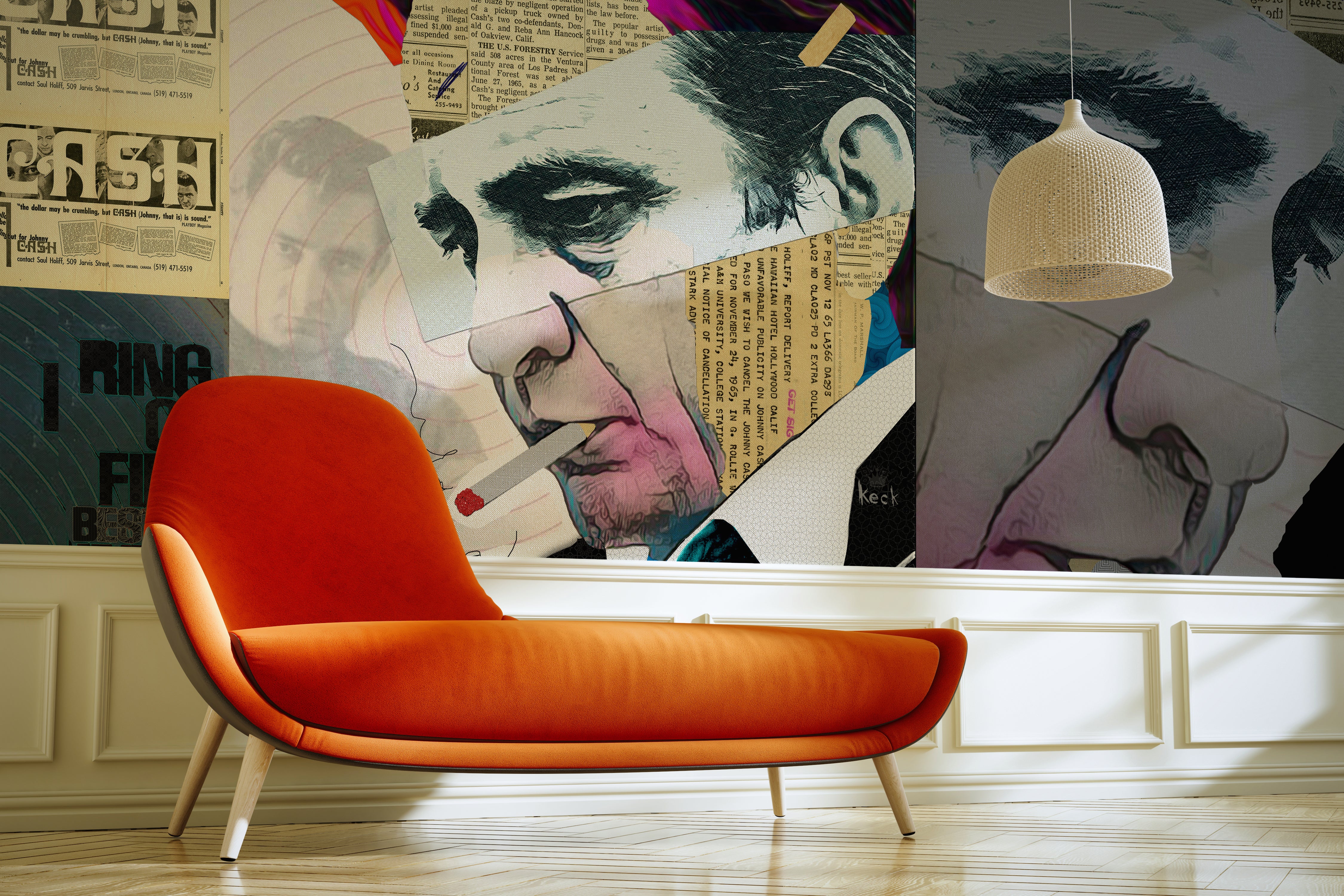 Interior room featuring a large textured wall mural by Michel Keck with a collage-style portrait of a man smoking, incorporating newspaper clippings and bold brushstrokes in muted tones. A modern orange chaise lounge and woven pendant light complete the setting.