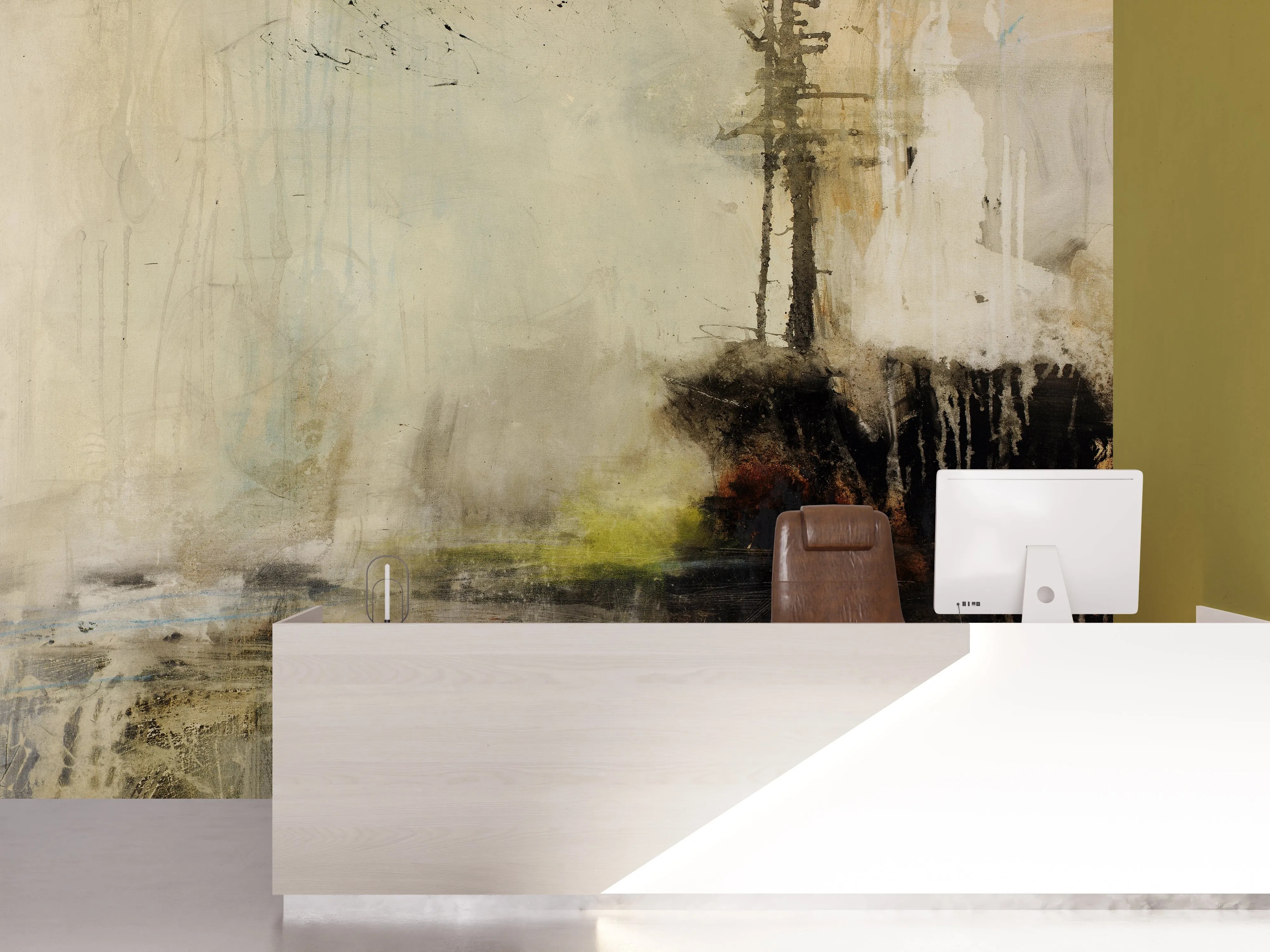 Reception area with a sleek white desk and brown leather chair in front of a large abstract wall mural by Michel Keck featuring muted beige, black, and yellow tones with textured, layered brushstrokes and vertical drips.