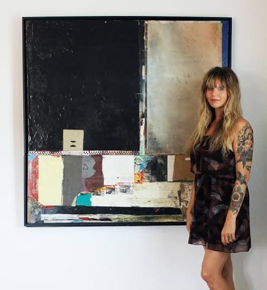 Michel Keck standing beside her artwork in the studio