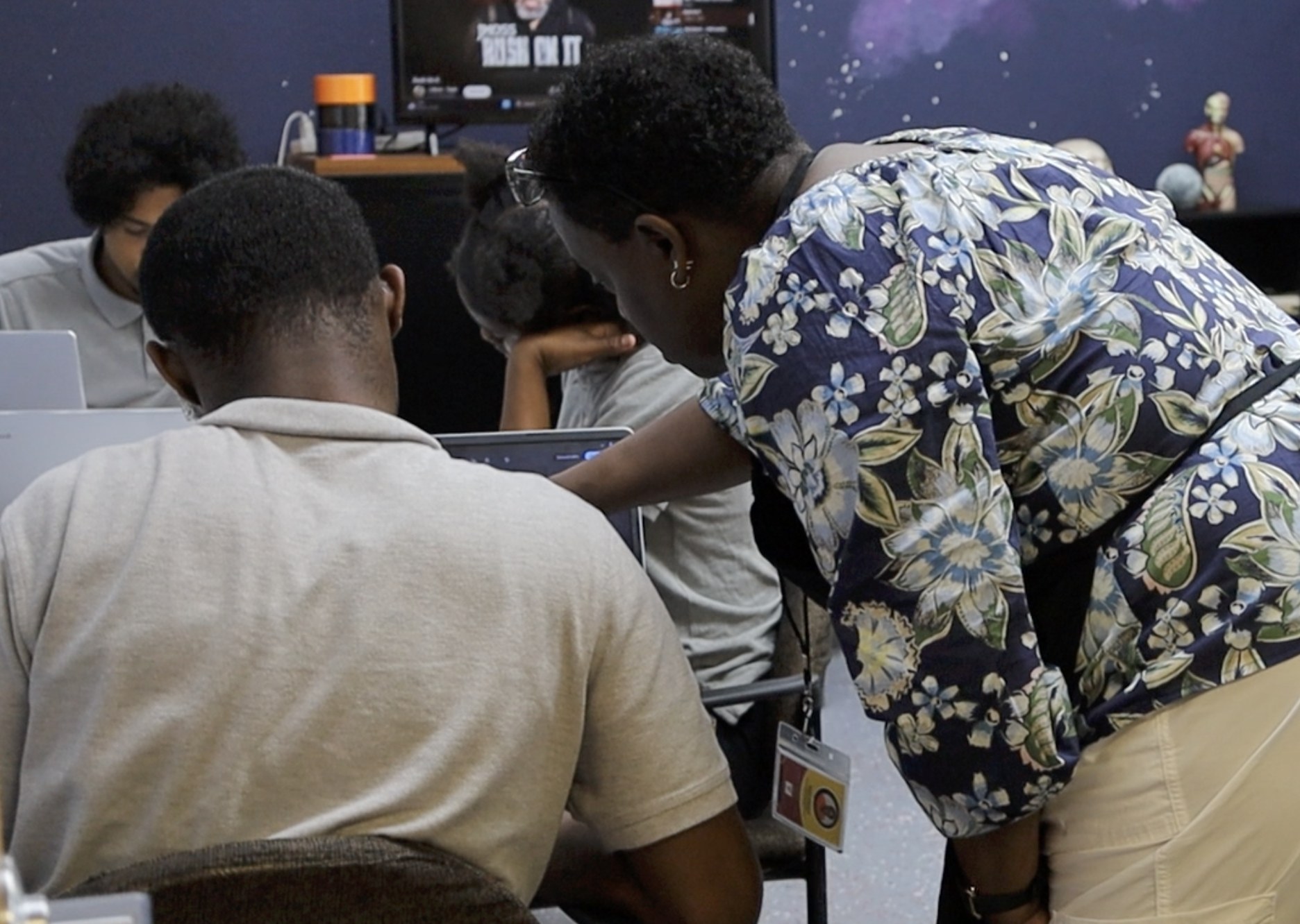 J.W. Reed Christian Academy educator supporting students during class