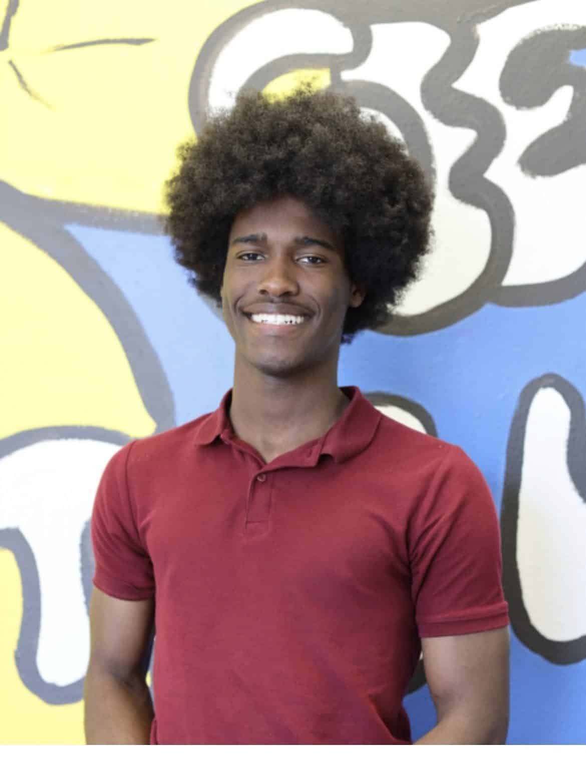 J.W. Reed Christian Academy graduate in a burgundy school polo