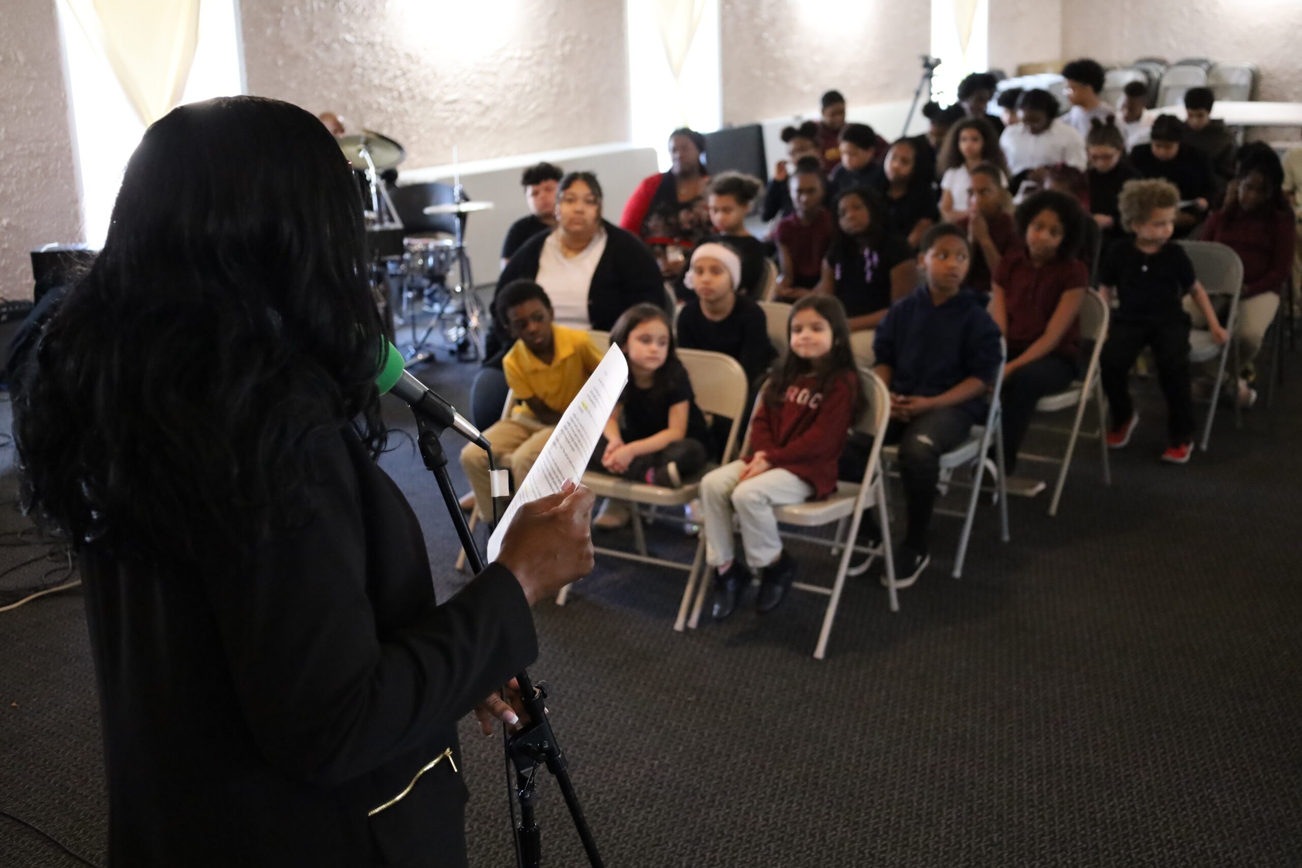 Students participating in a J.W. Reed Christian Academy school gathering