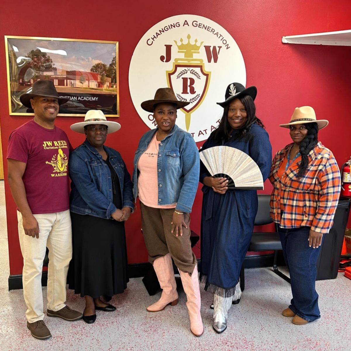 Five JWRCA staff members wearing western outfits and cowboy hats for Western Wednesday