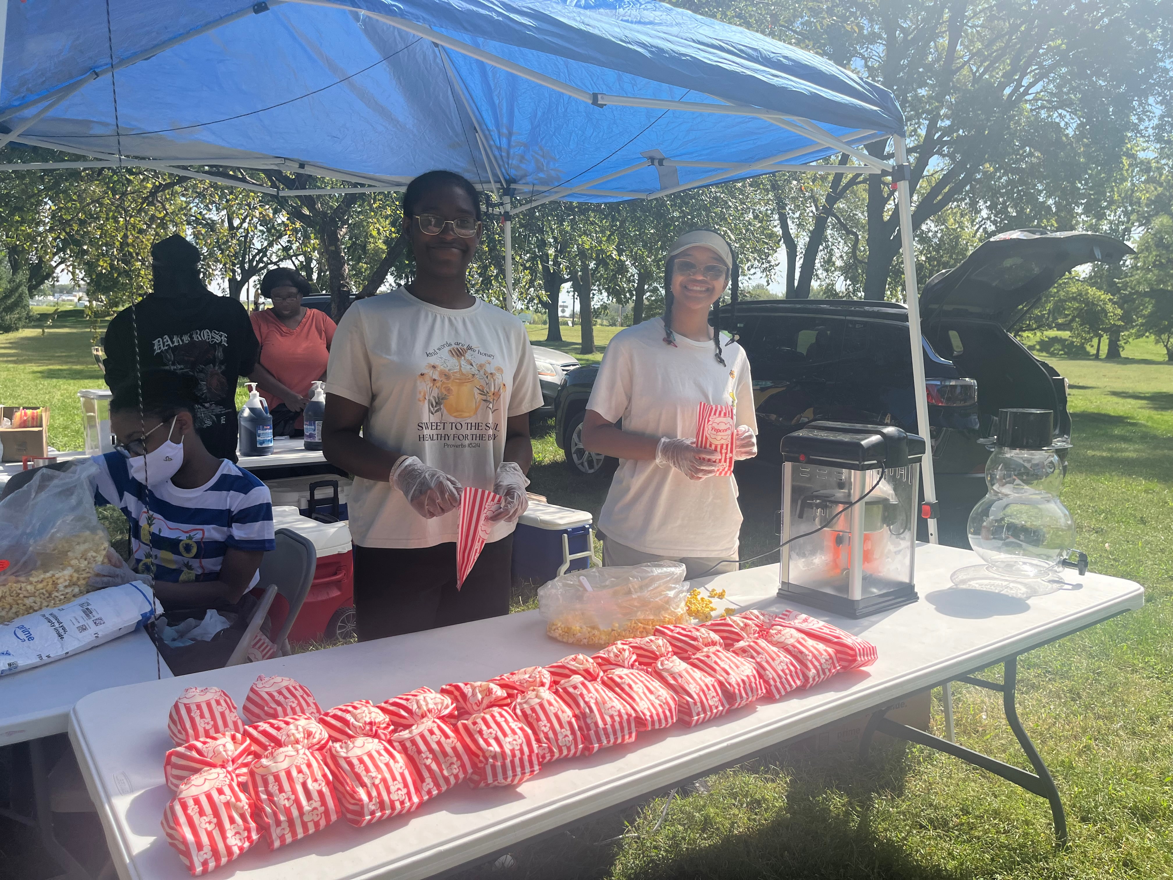 JWRCA students serving popcorn at a Family and Friends Volunteer Event