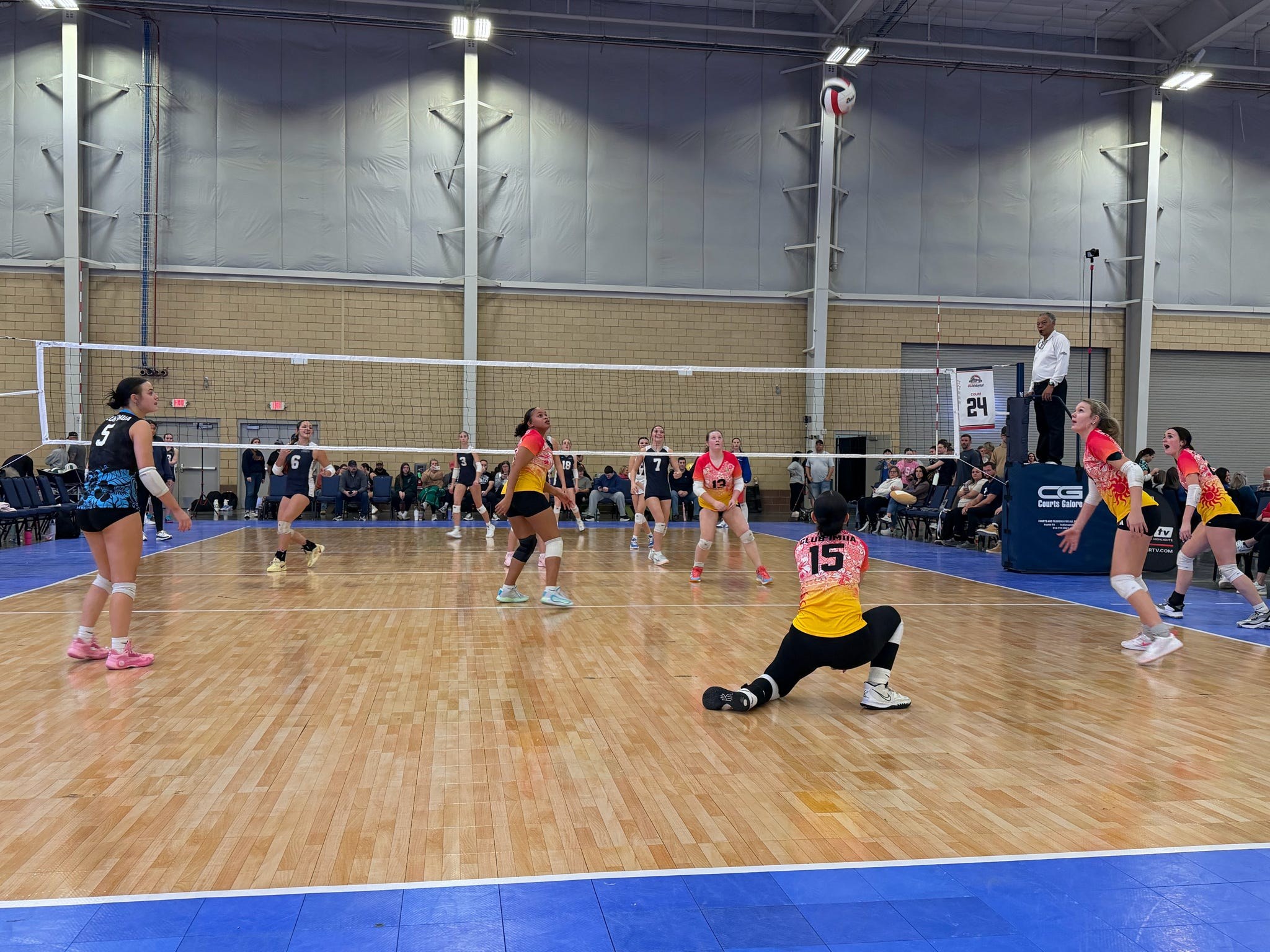 Club IMUA Volleyball athlete working hard during a rally
