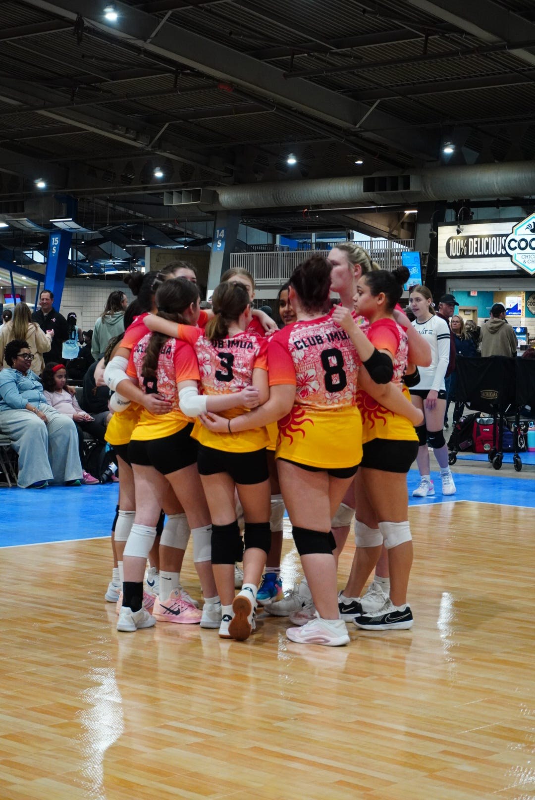 Club IMUA Volleyball athletes celebrating together at a tournament