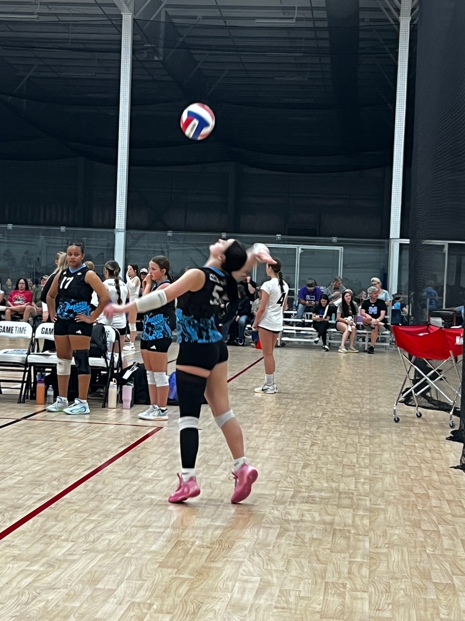 Club IMUA Volleyball athlete preparing to attack the ball at the net