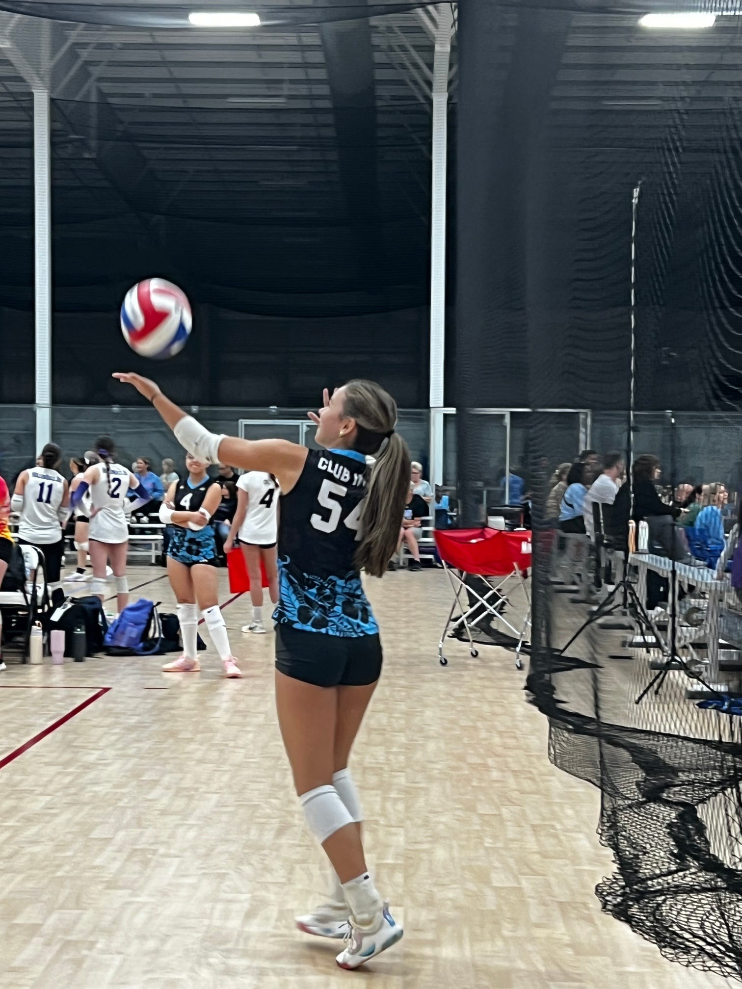 Club IMUA Volleyball athlete preparing to serve