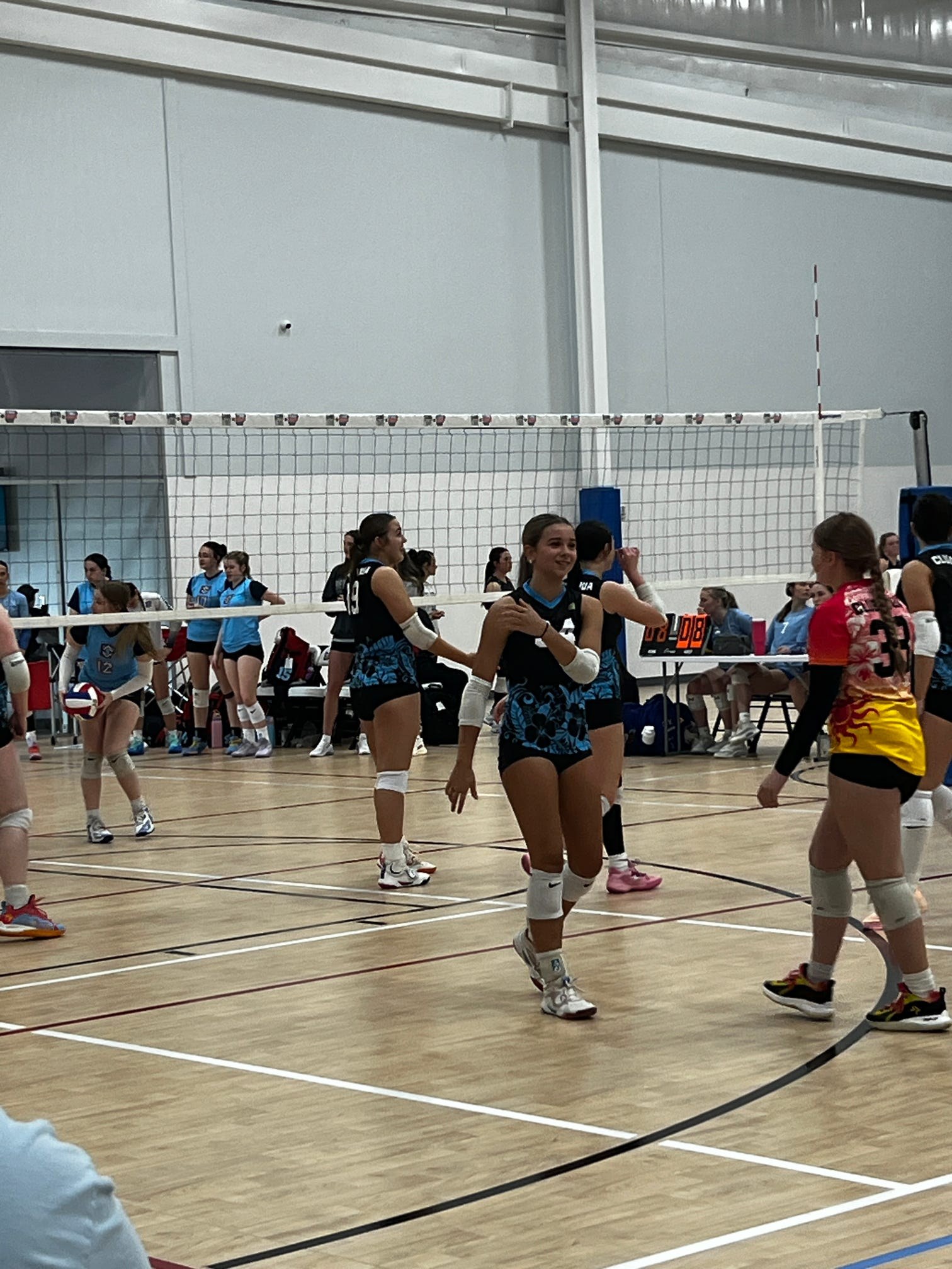Club IMUA Volleyball athlete practicing a controlled volleyball pass