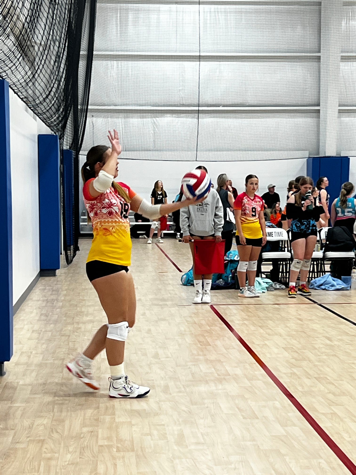 Club IMUA Volleyball athlete jumping near the net during practice