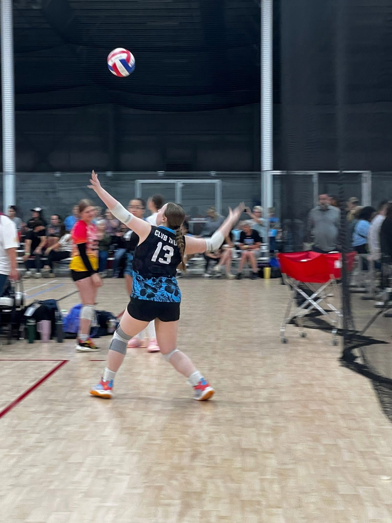 Club IMUA Volleyball athlete setting a volleyball during practice