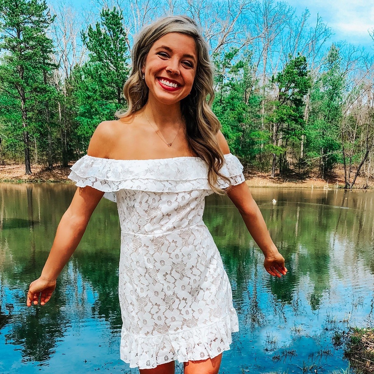 Beautiful girl at a pristine forest lake, photograph