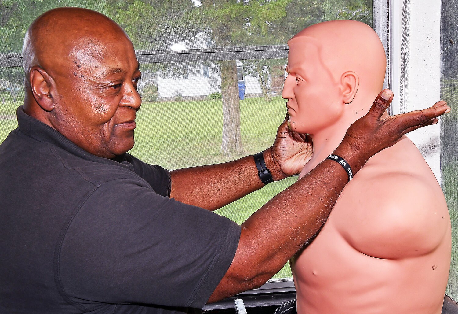 Grandmaster Ralph Anthony Kemmerlin, Sr. demonstrating controlled training technique with a practice mannequin