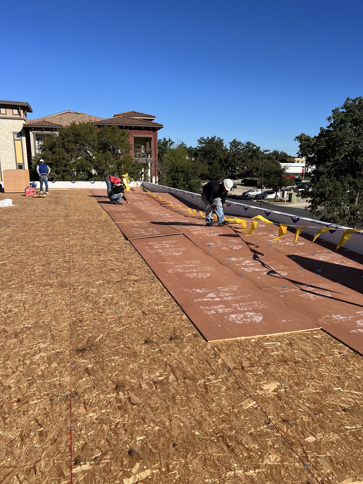 Commercial roofing crew at work