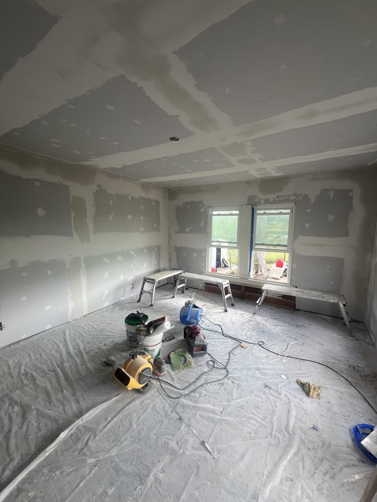 Interior reconstruction in progress with new drywall