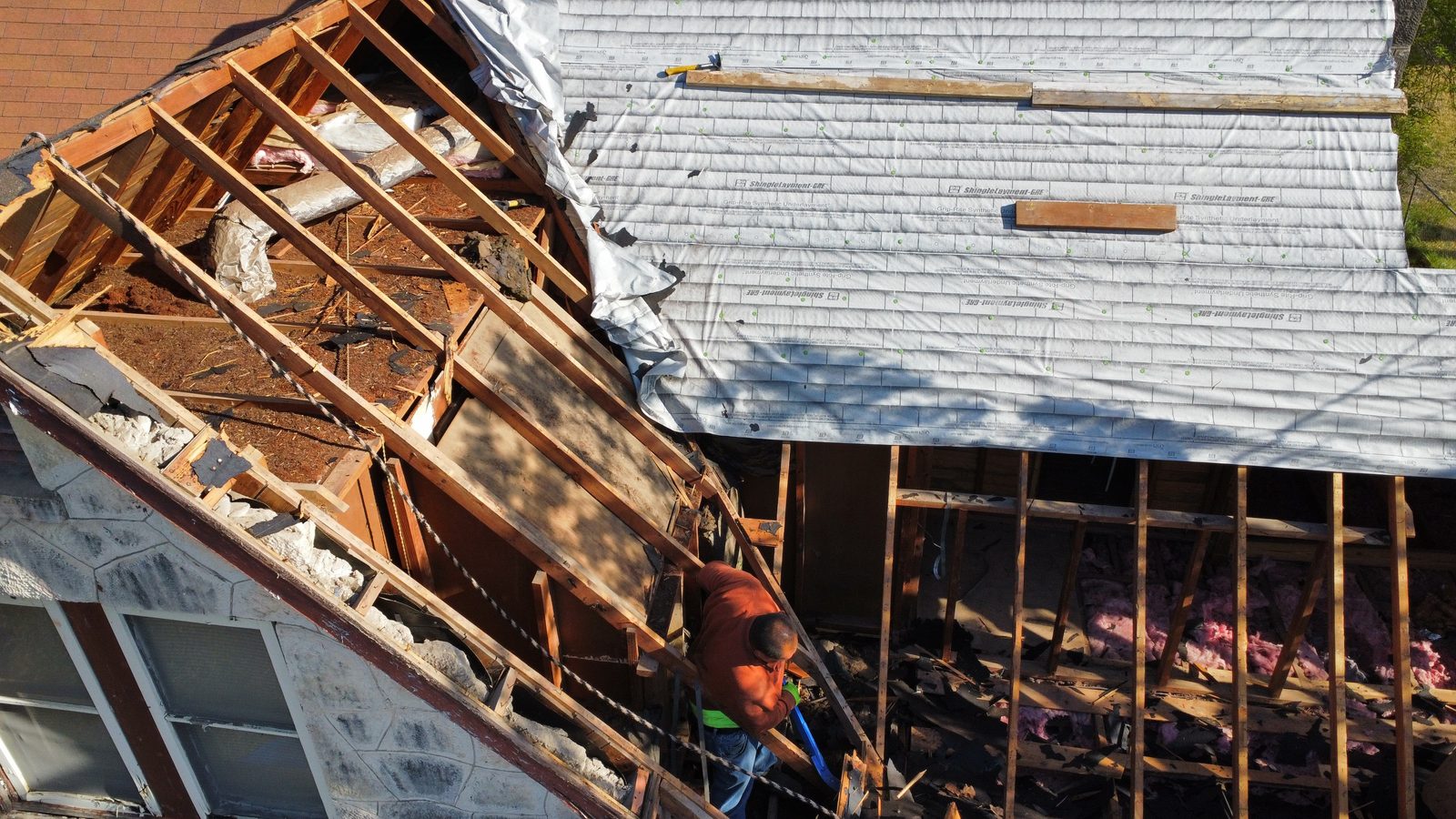 Roof framing repair in progress after storm damage