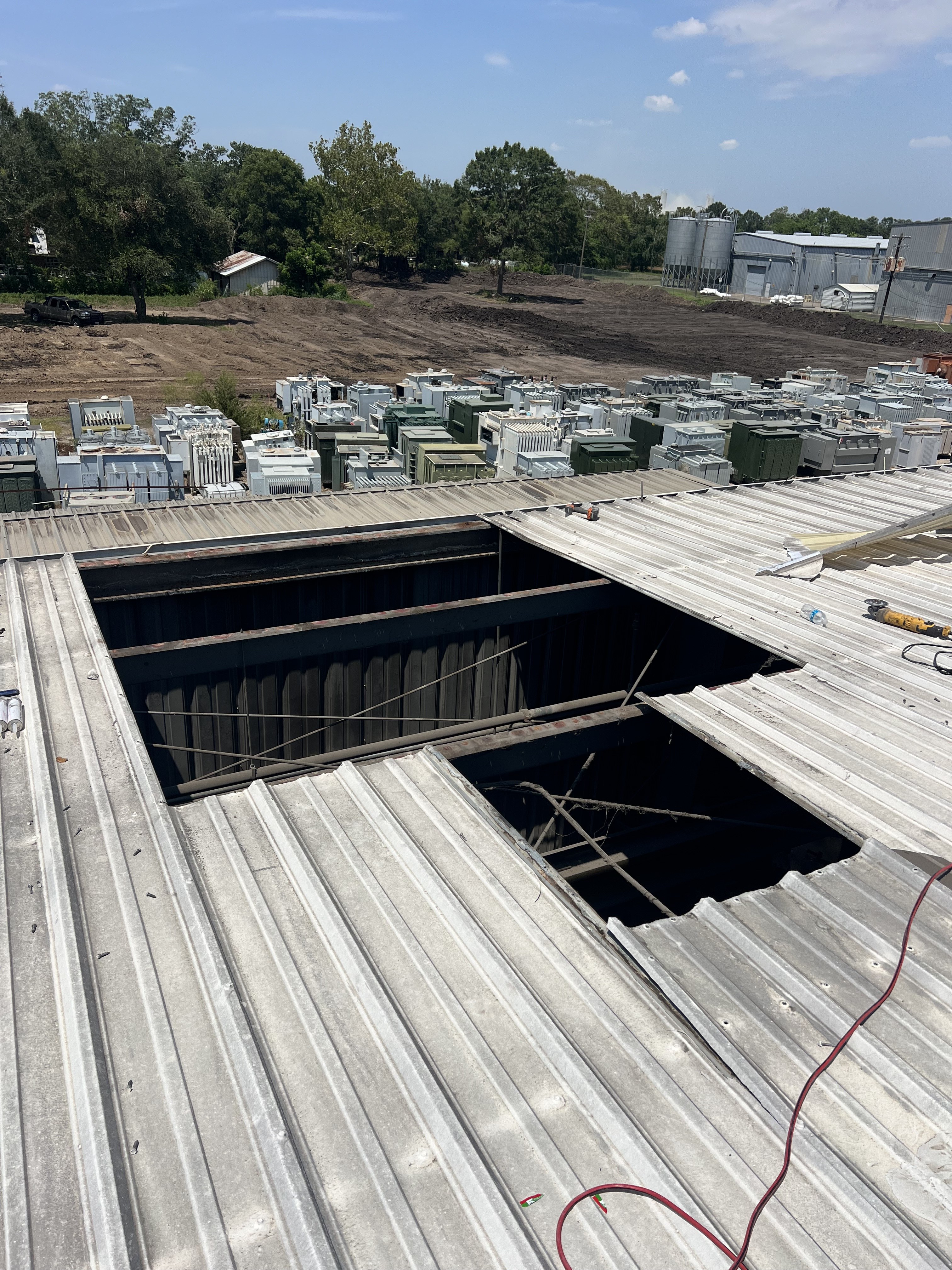 Commercial roof opening documented for facility repair