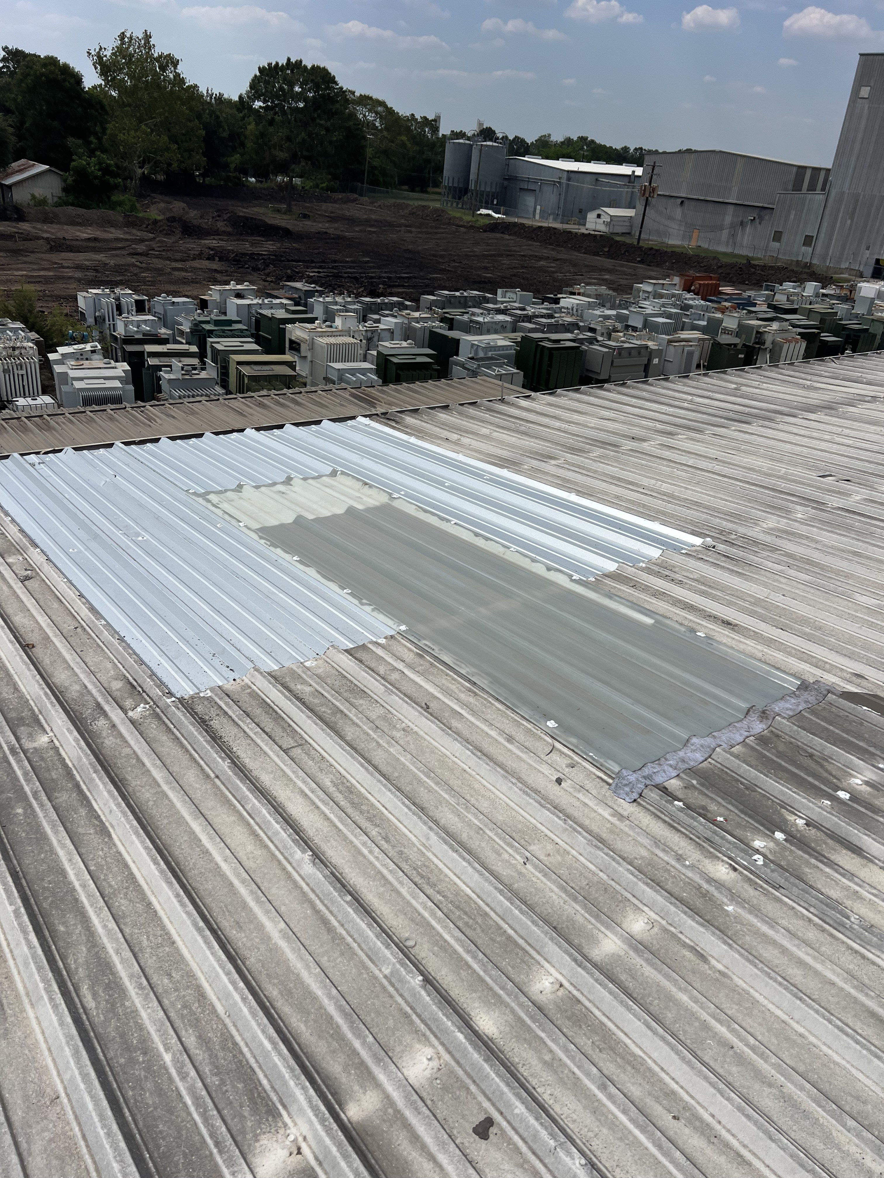 New metal panels installed on a commercial facility roof