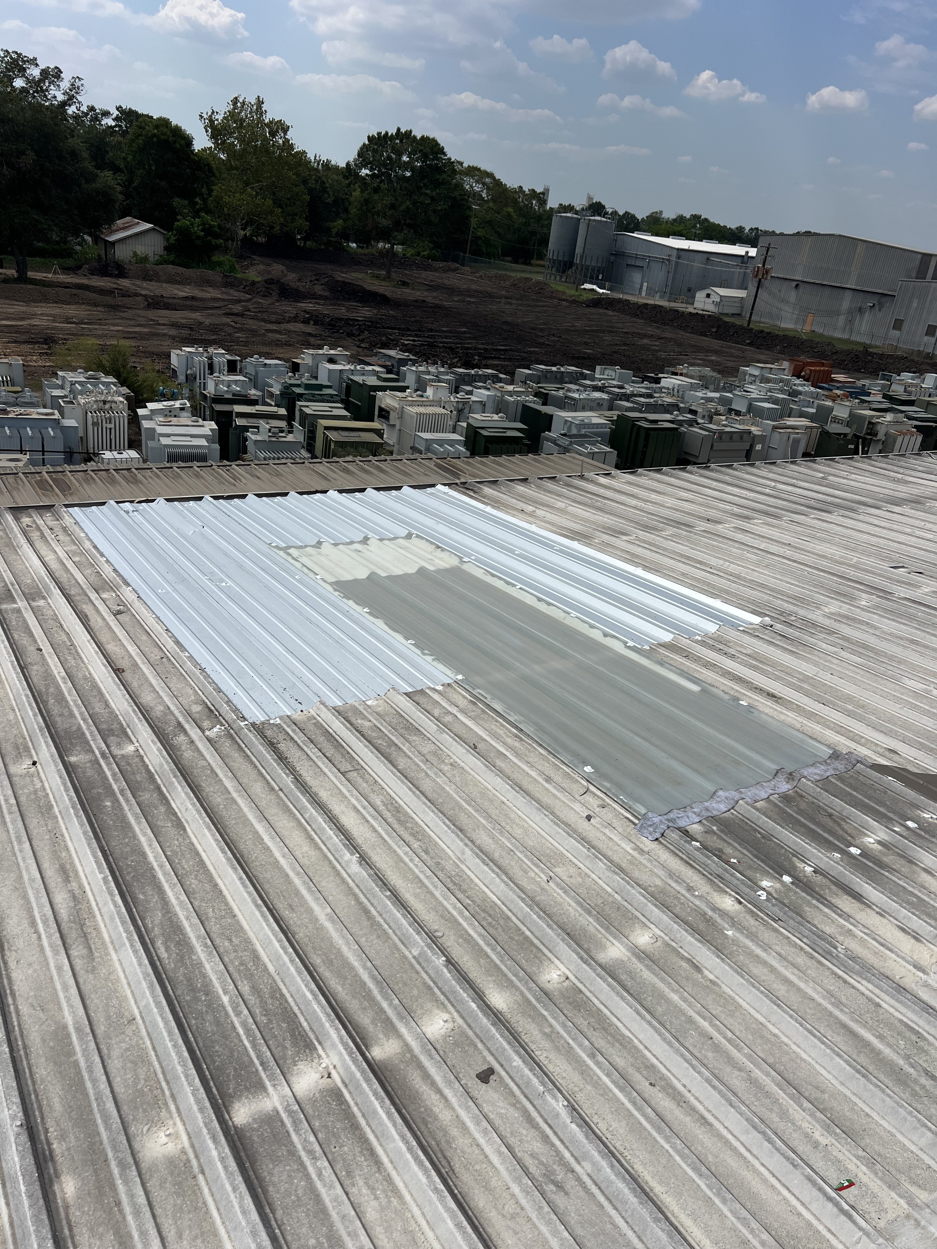 Commercial facility roof repair with replacement panels