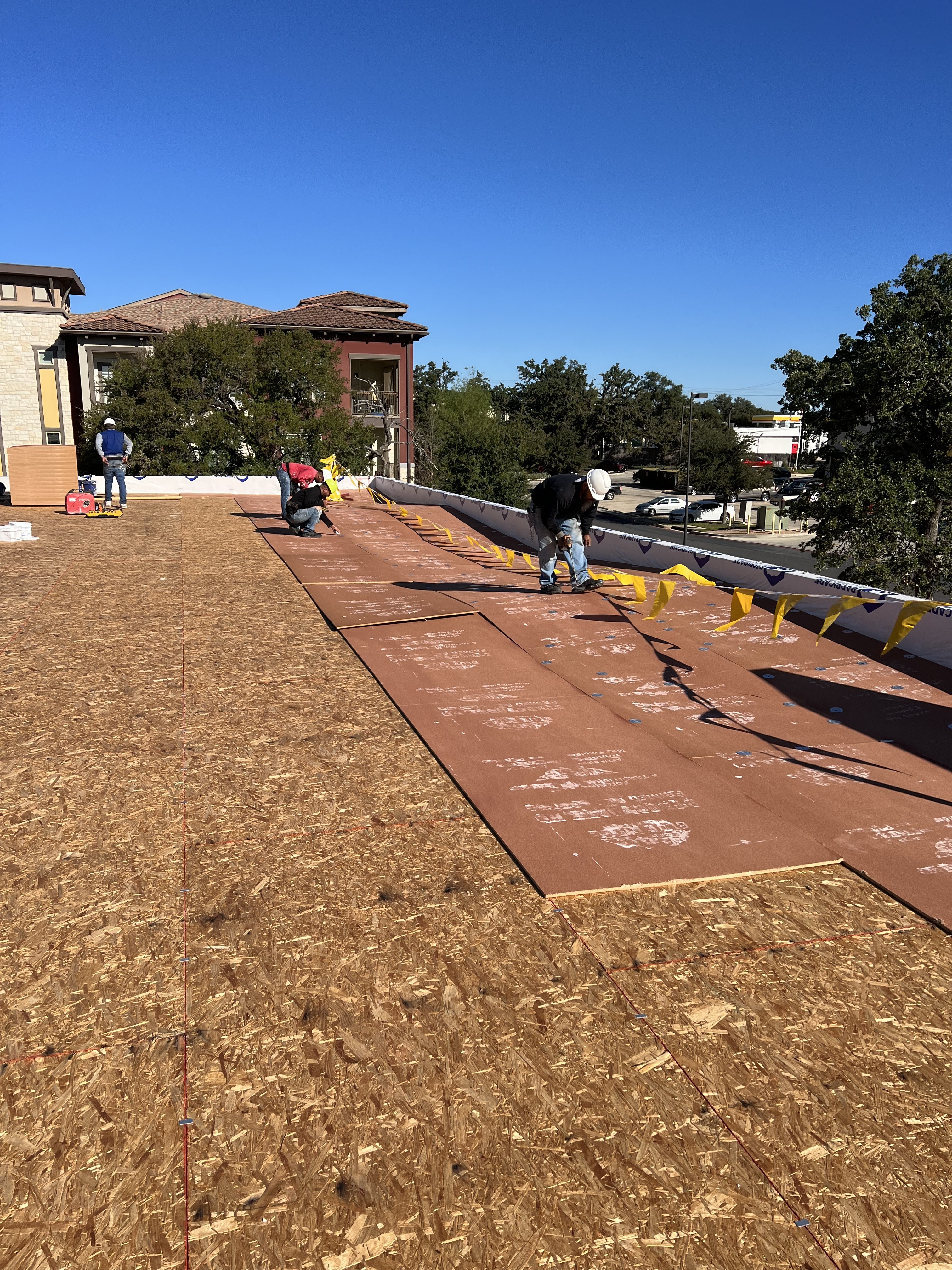 Commercial roofing crew at work