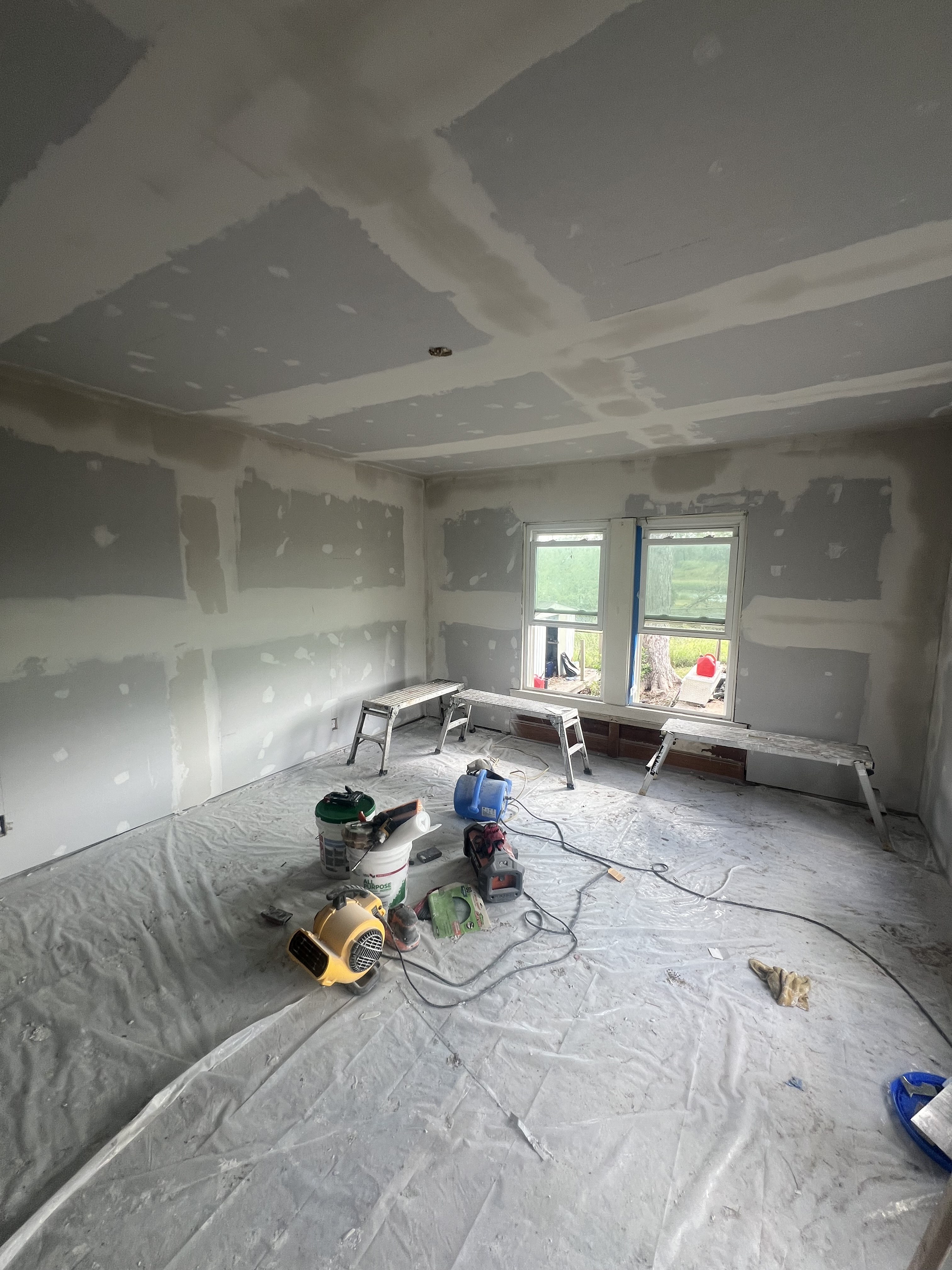 Interior reconstruction in progress with new drywall