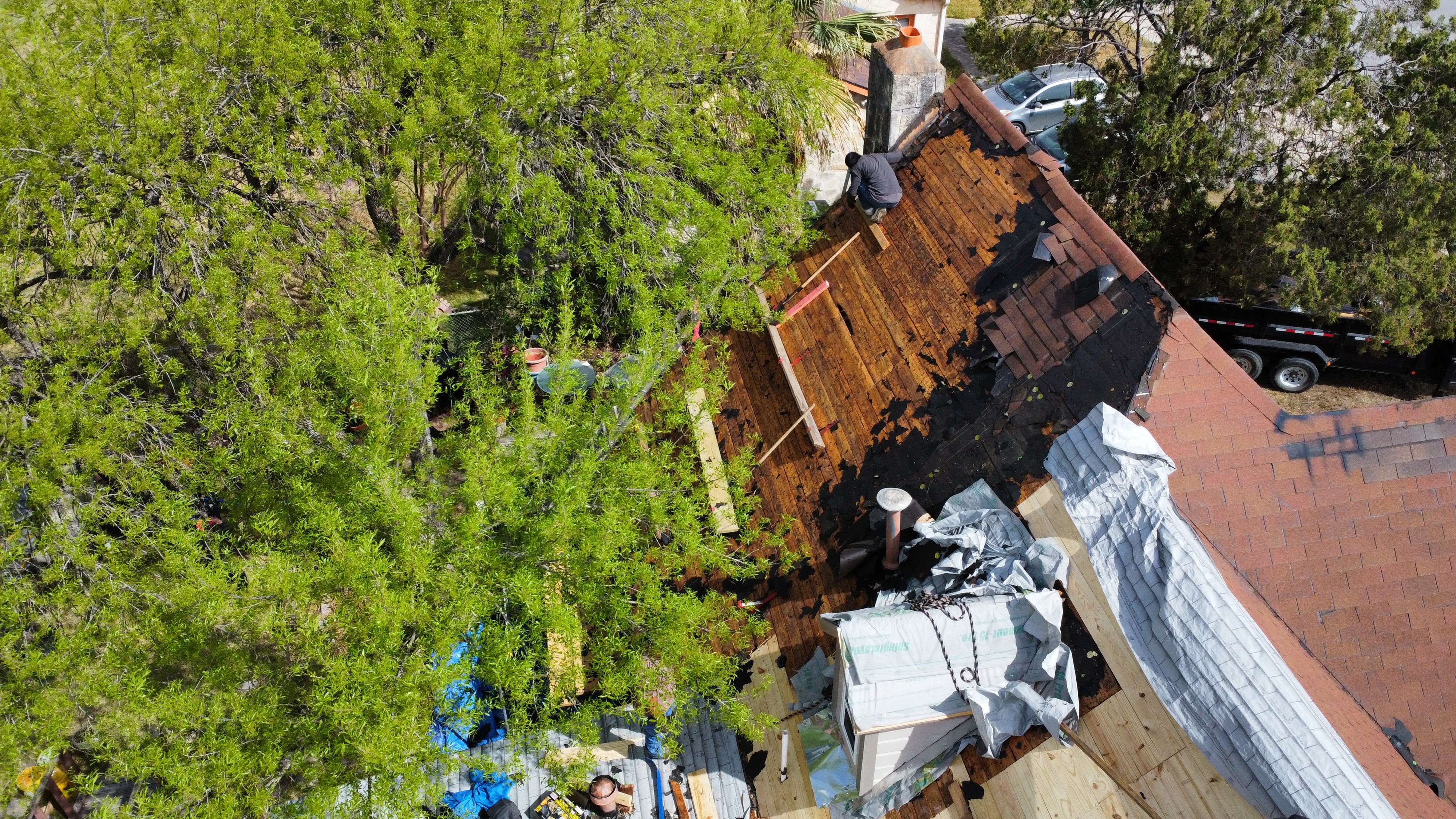 Storm-damaged roof structure under repair