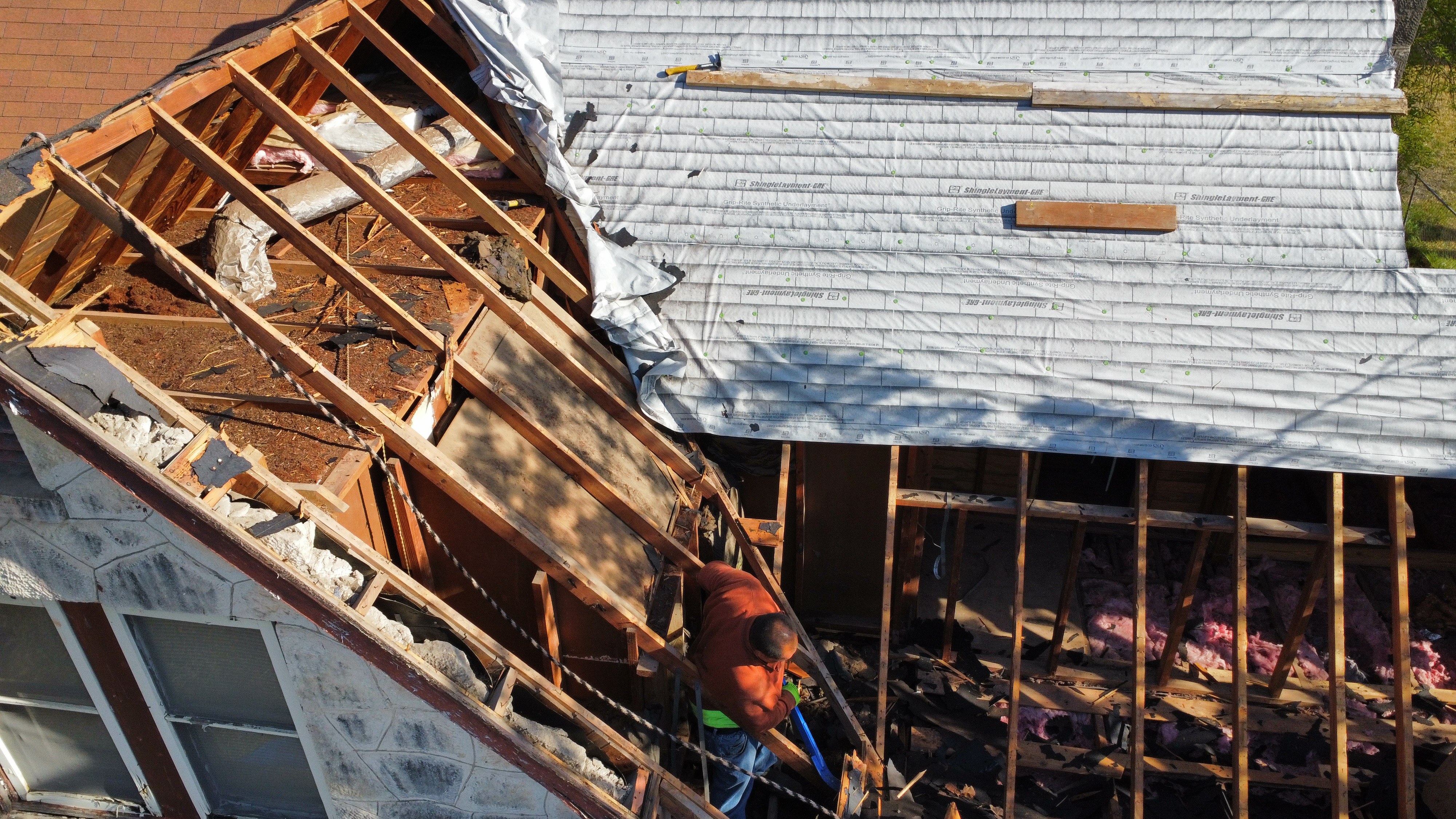 Roof framing repair in progress after storm damage