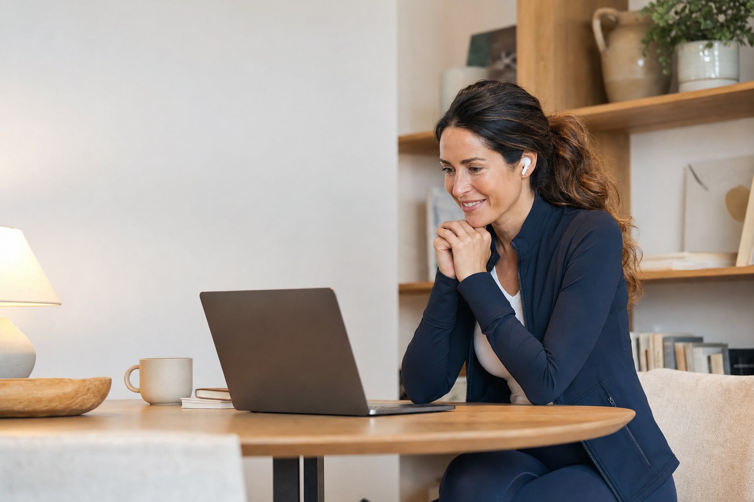 Woman speaking with a telehealth provider from home