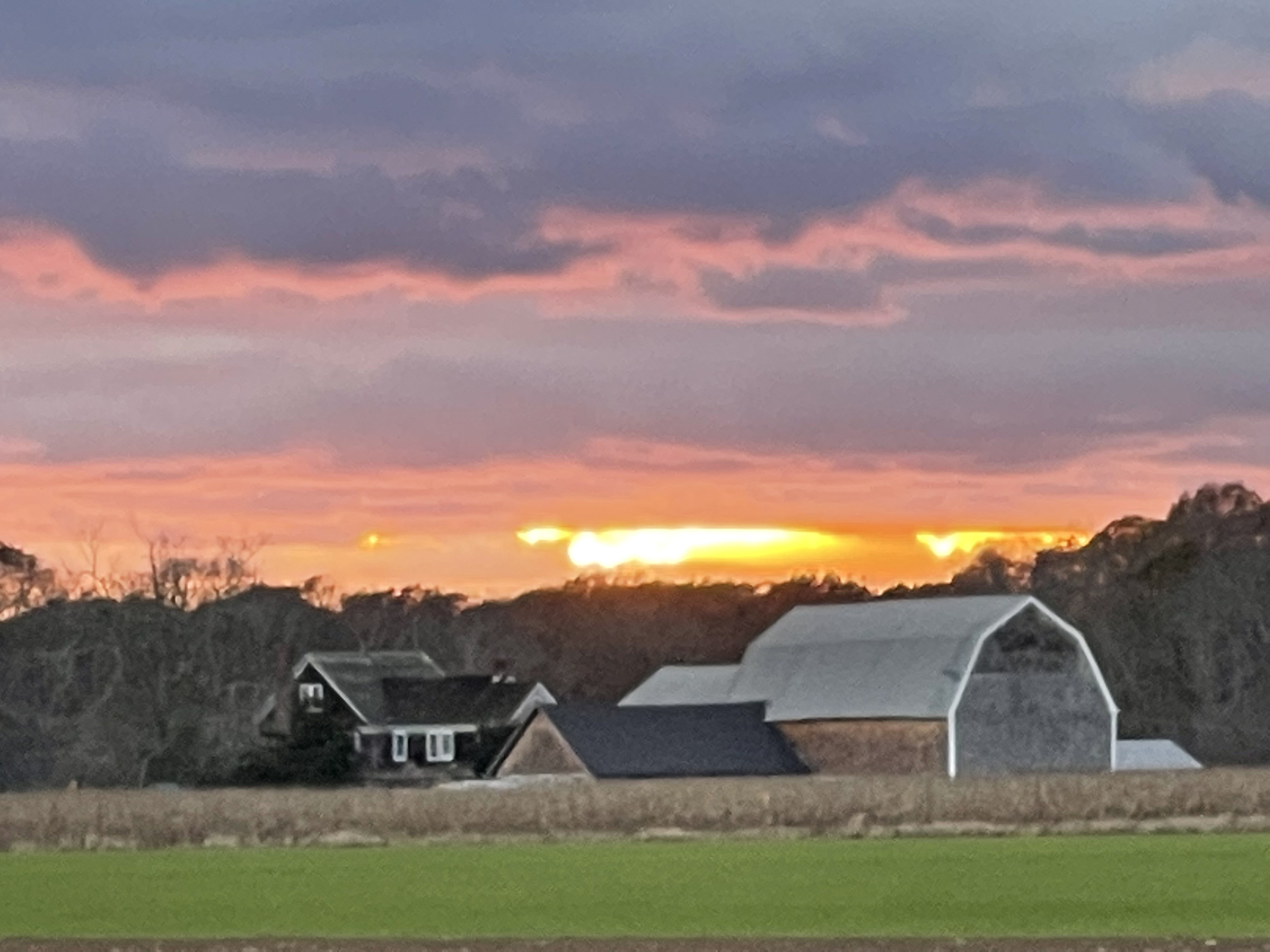 Sunset over an East Hampton barn and fields