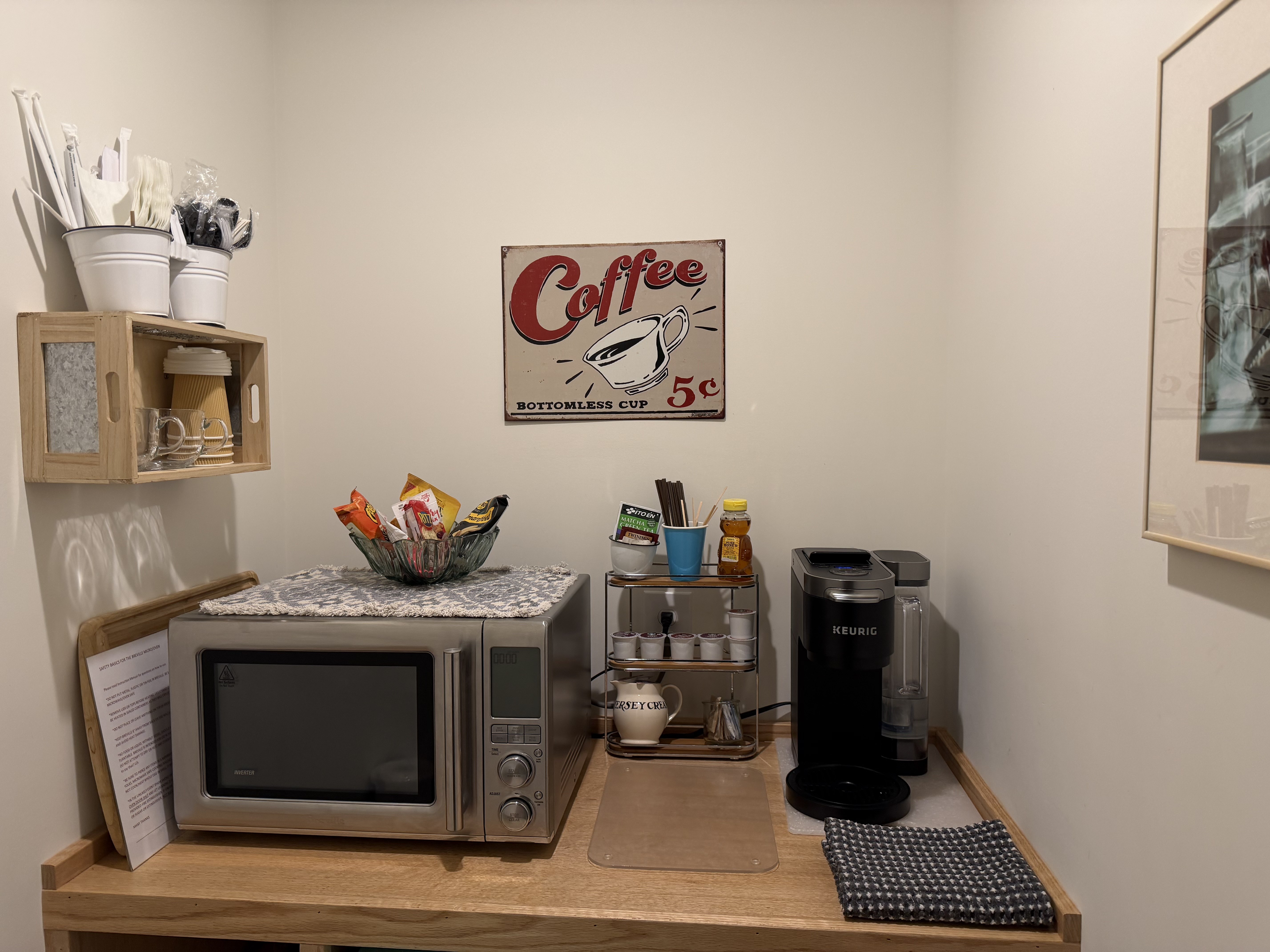 Kitchenette with coffee station, microwave, and guest essentials
