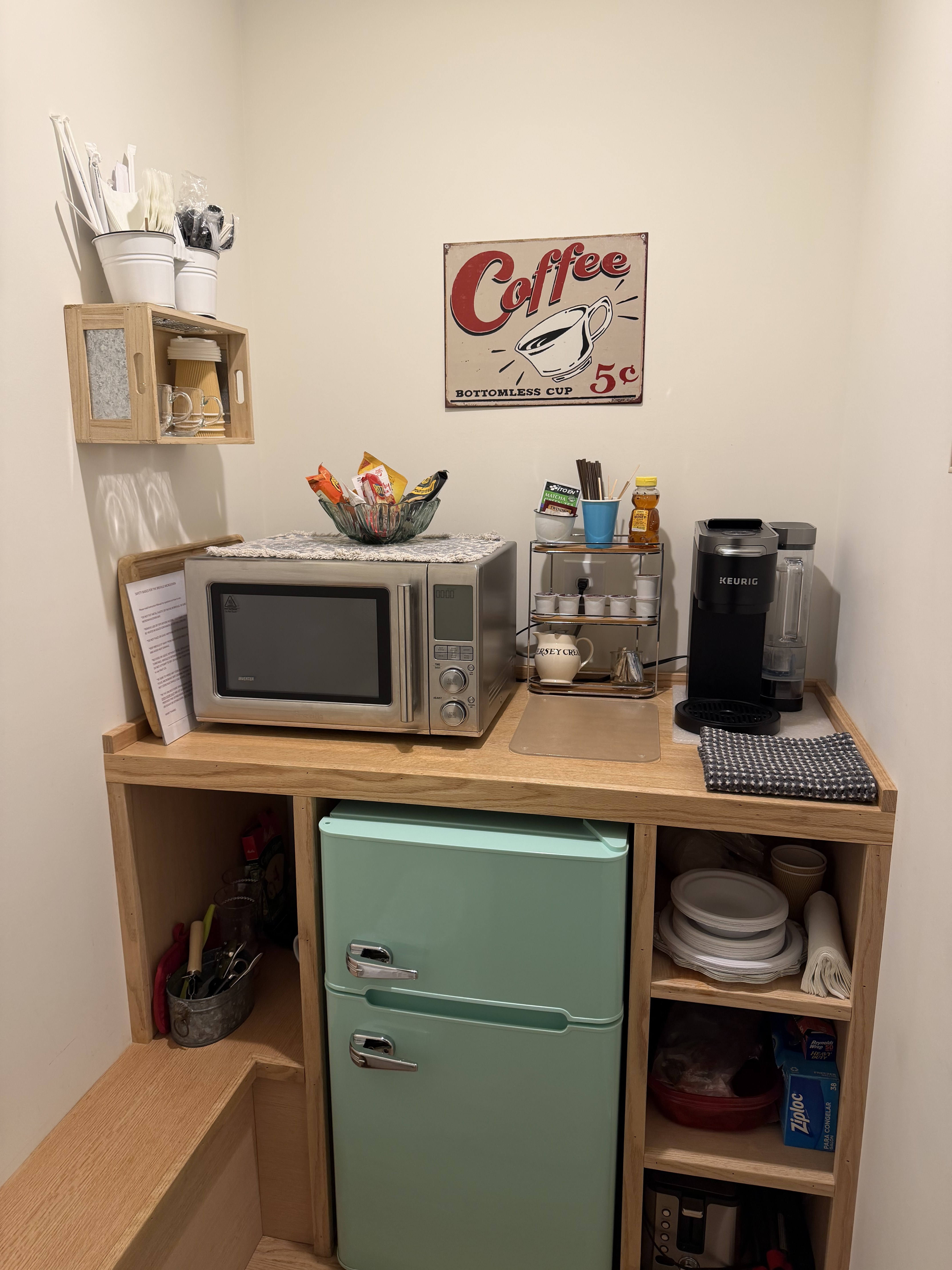 Kitchenette with mint fridge, microwave, coffee maker, and guest essentials