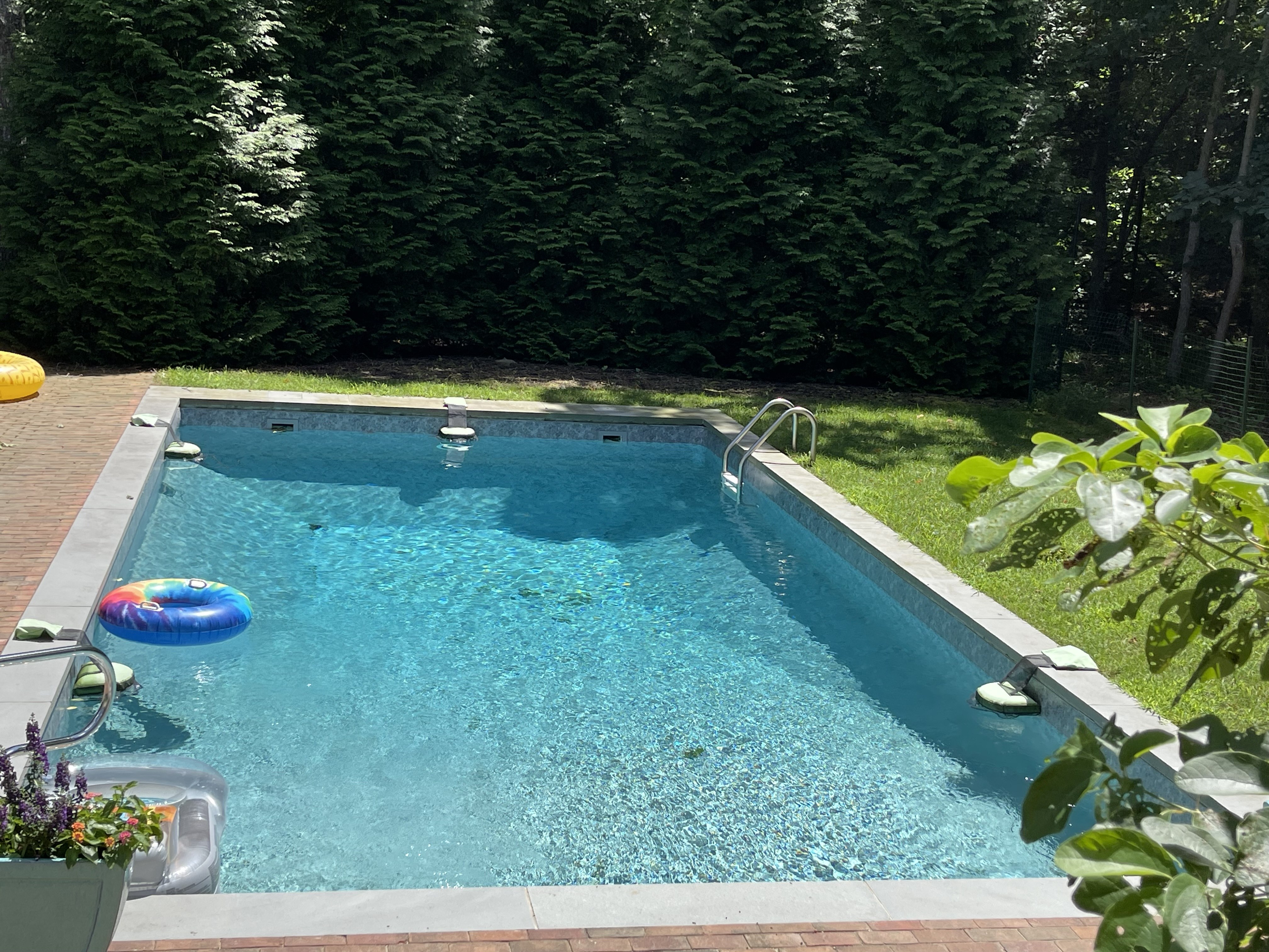 Private pool sparkling in the summer sun