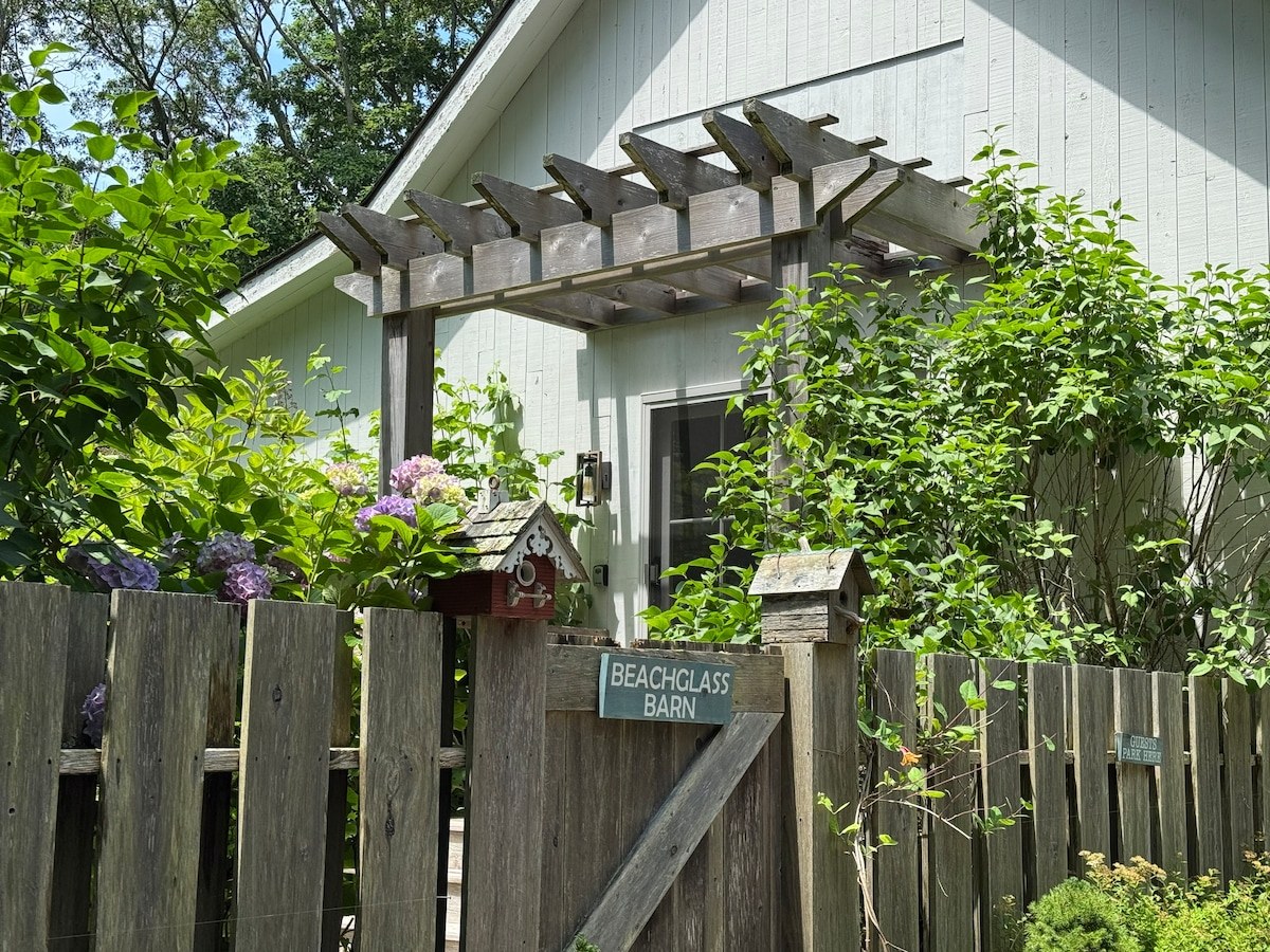 Beachglass Barn gate and barn exterior surrounded by hydrangeas