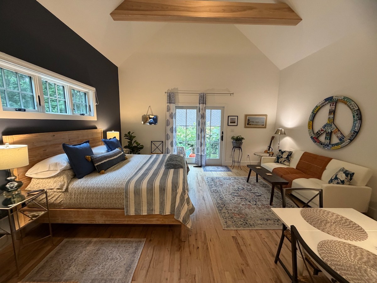 Open king suite with sitting area and private patio door
