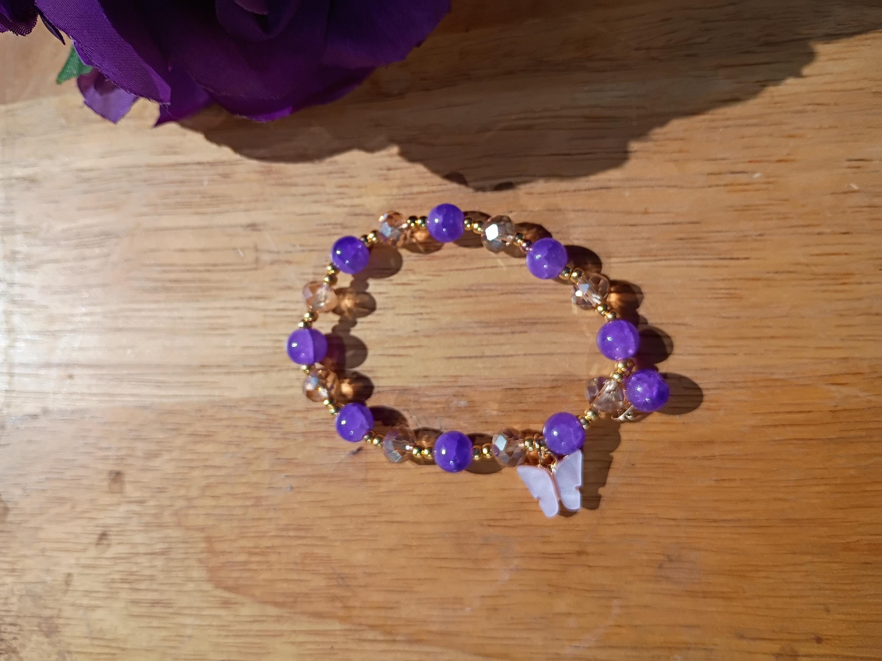Beaded bracelets/ butterfly charms/