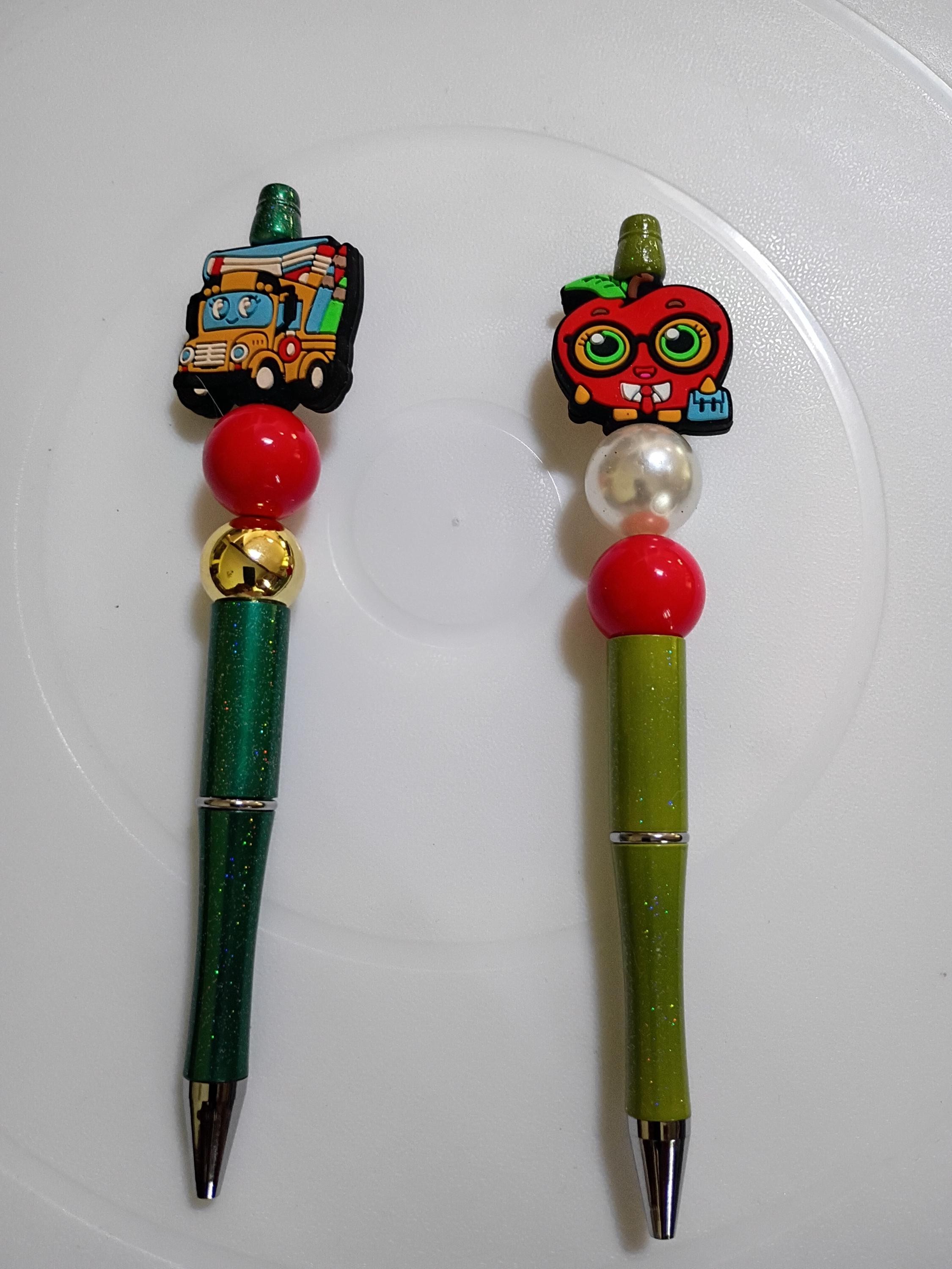 Beaded ink pens