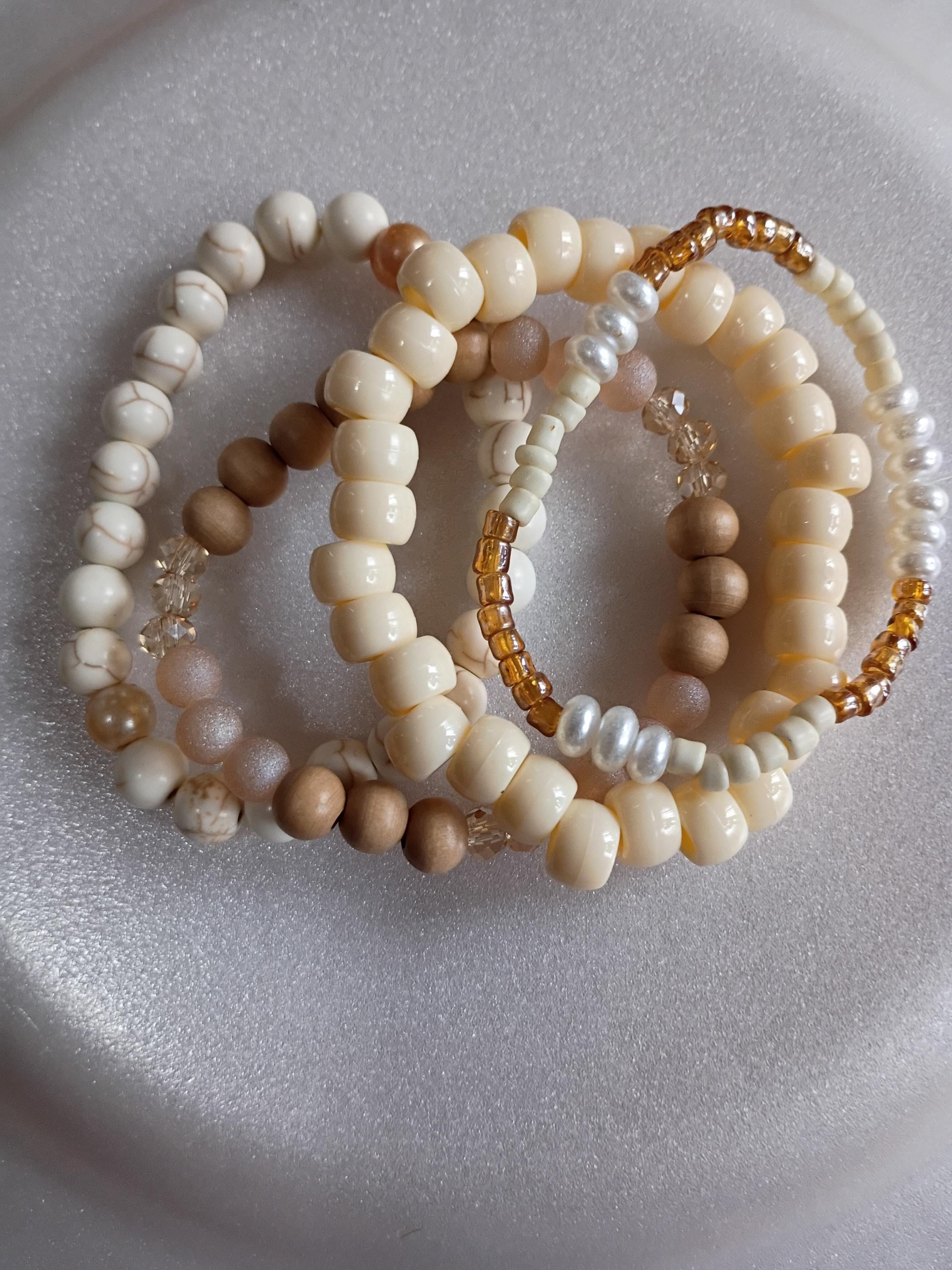 Four-piece stack of bracelets.