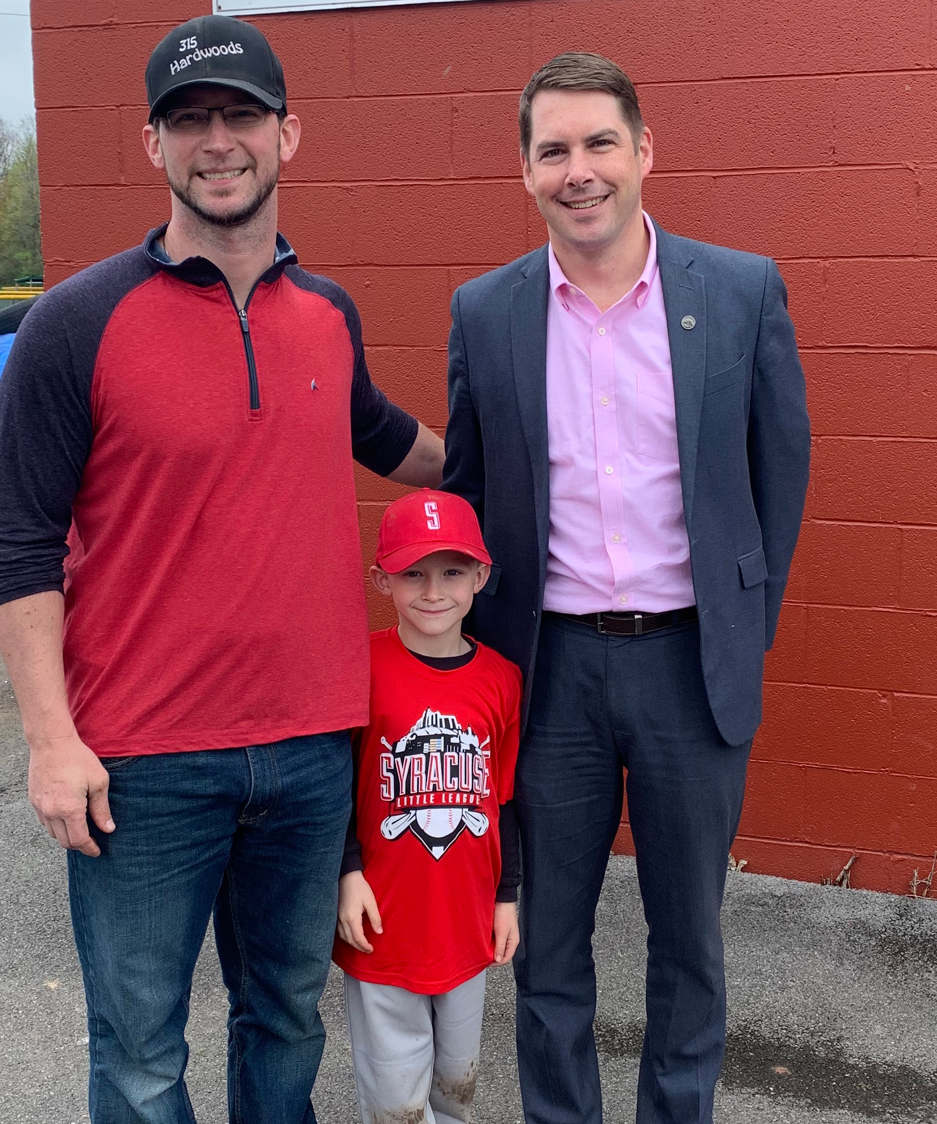 315 Hardwoods supporter with Syracuse Little League players