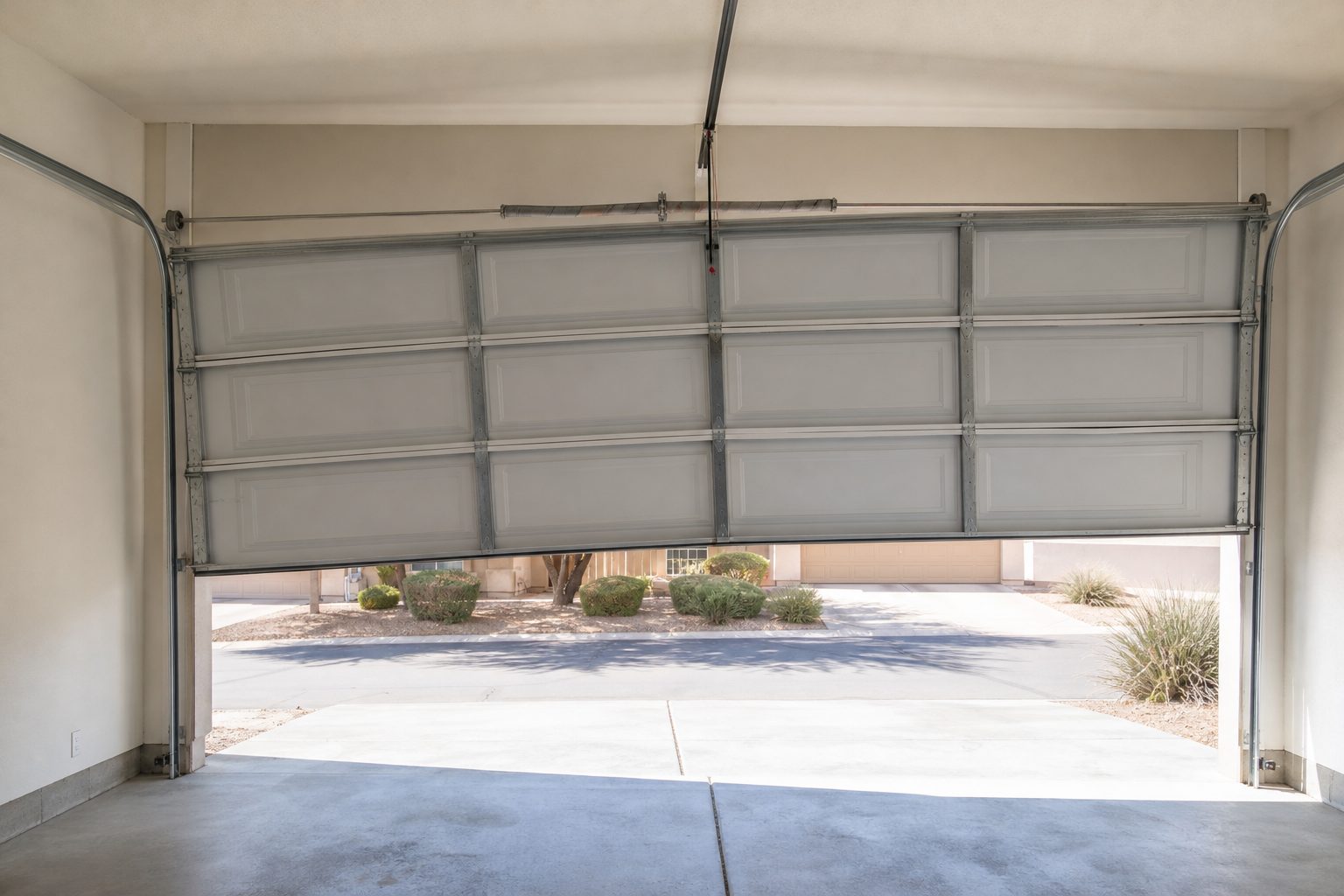 Garage door lifting unevenly, with one side lower than the other