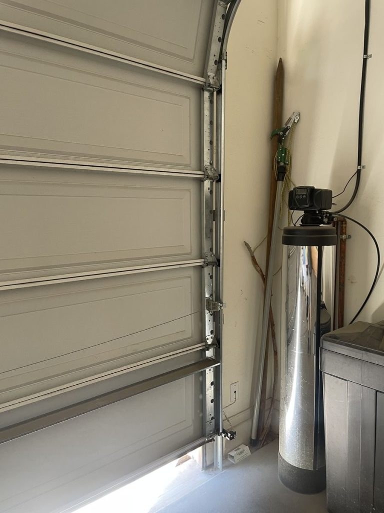 Worn garage door rollers before repair