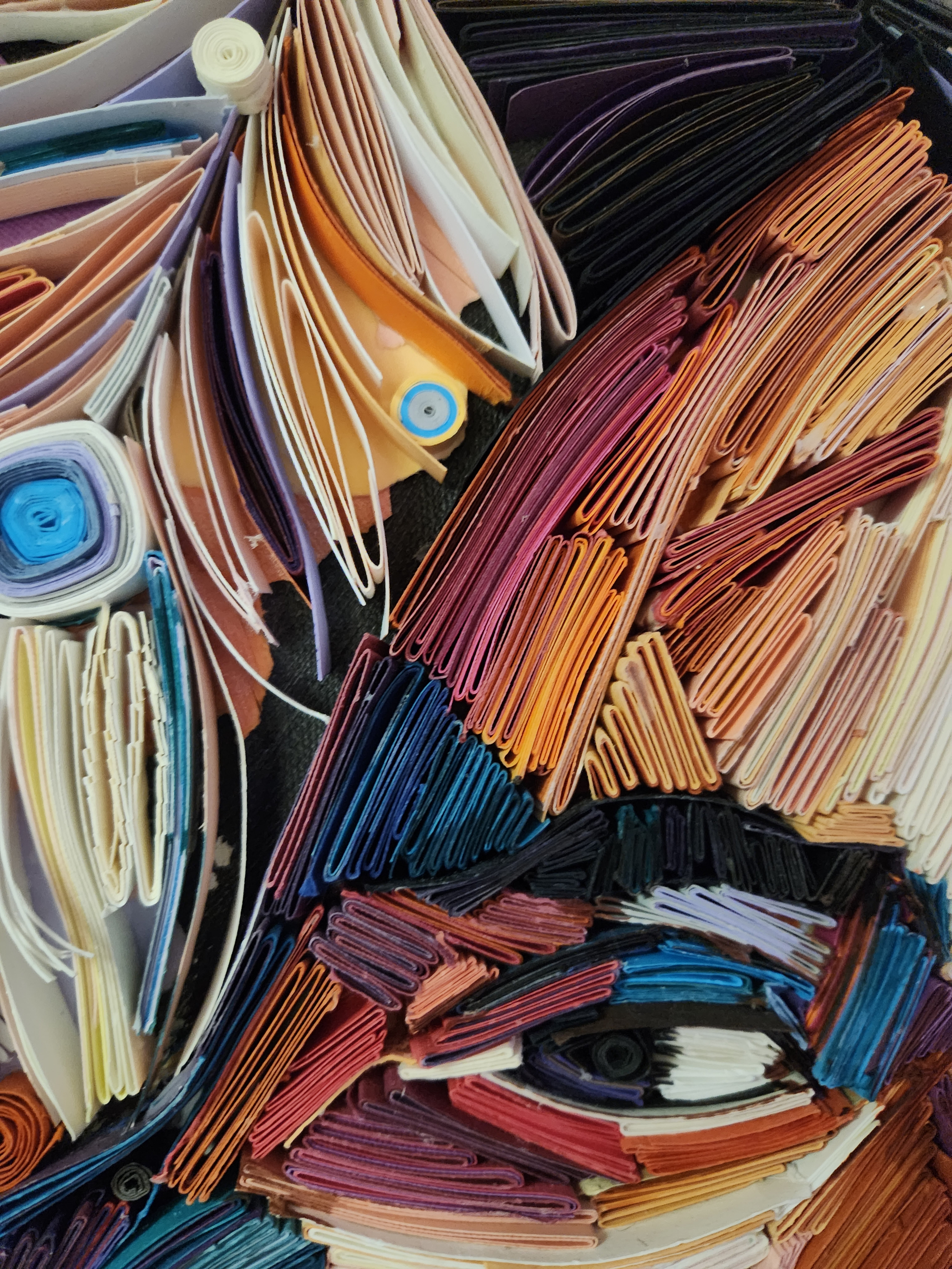 Close-up of layered, folded paper in a Kairee Cardoso artwork